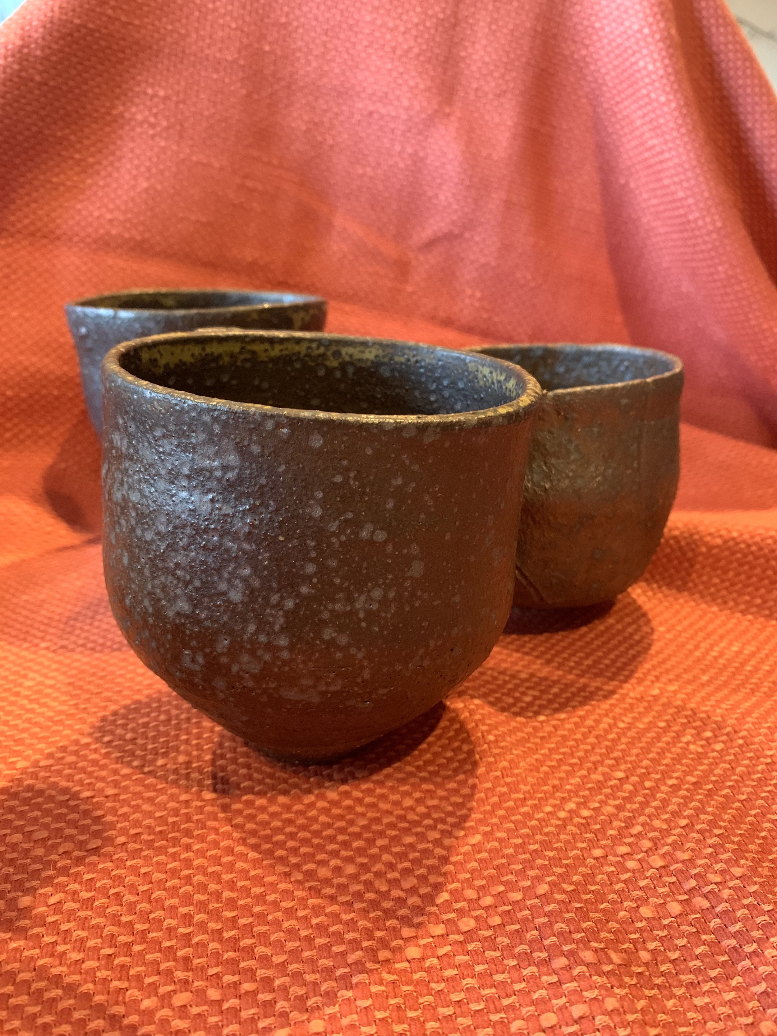 Tapered cup, dark reduction fired stoneware