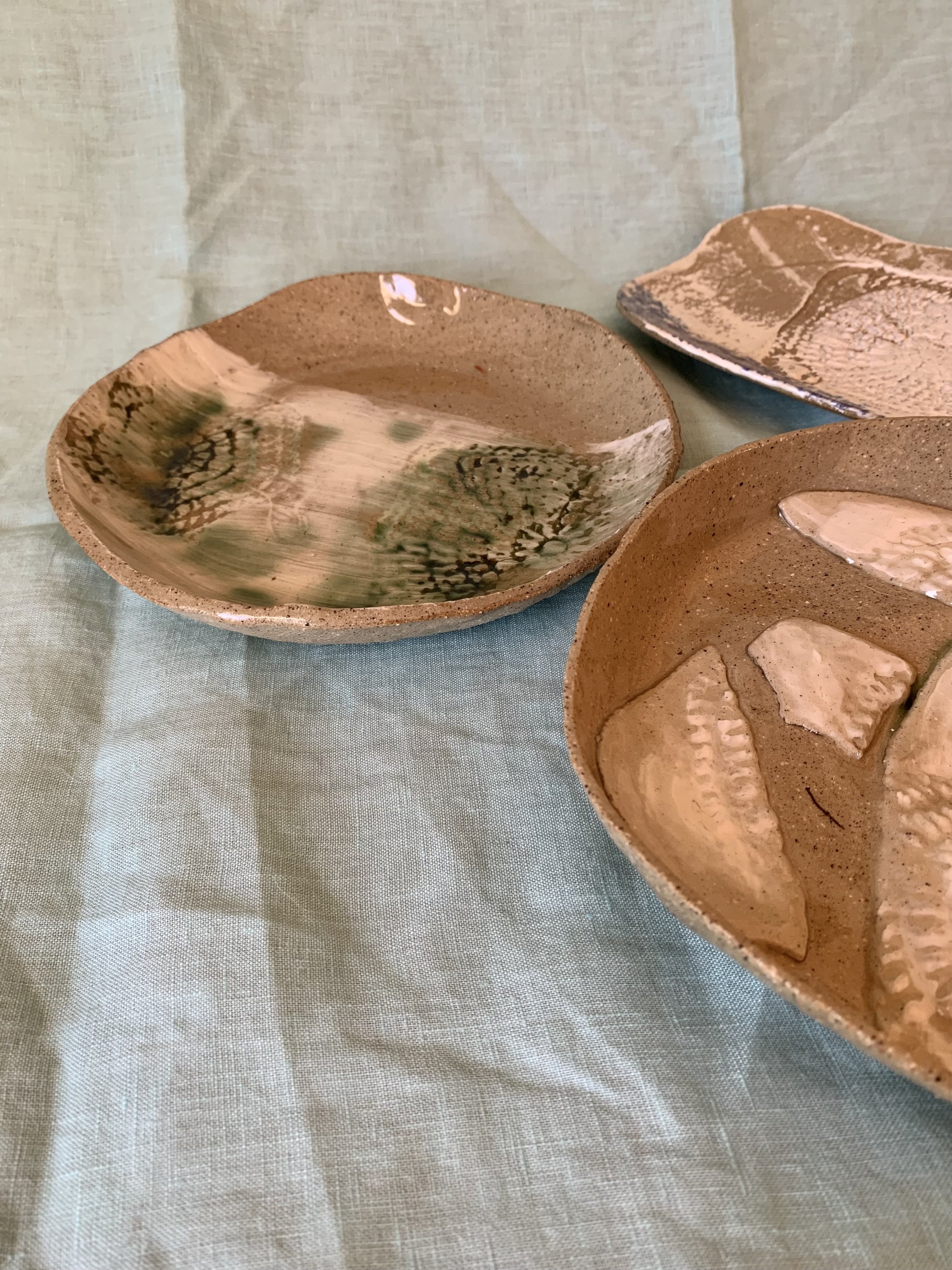 Slip decorated stoneware serving dishes