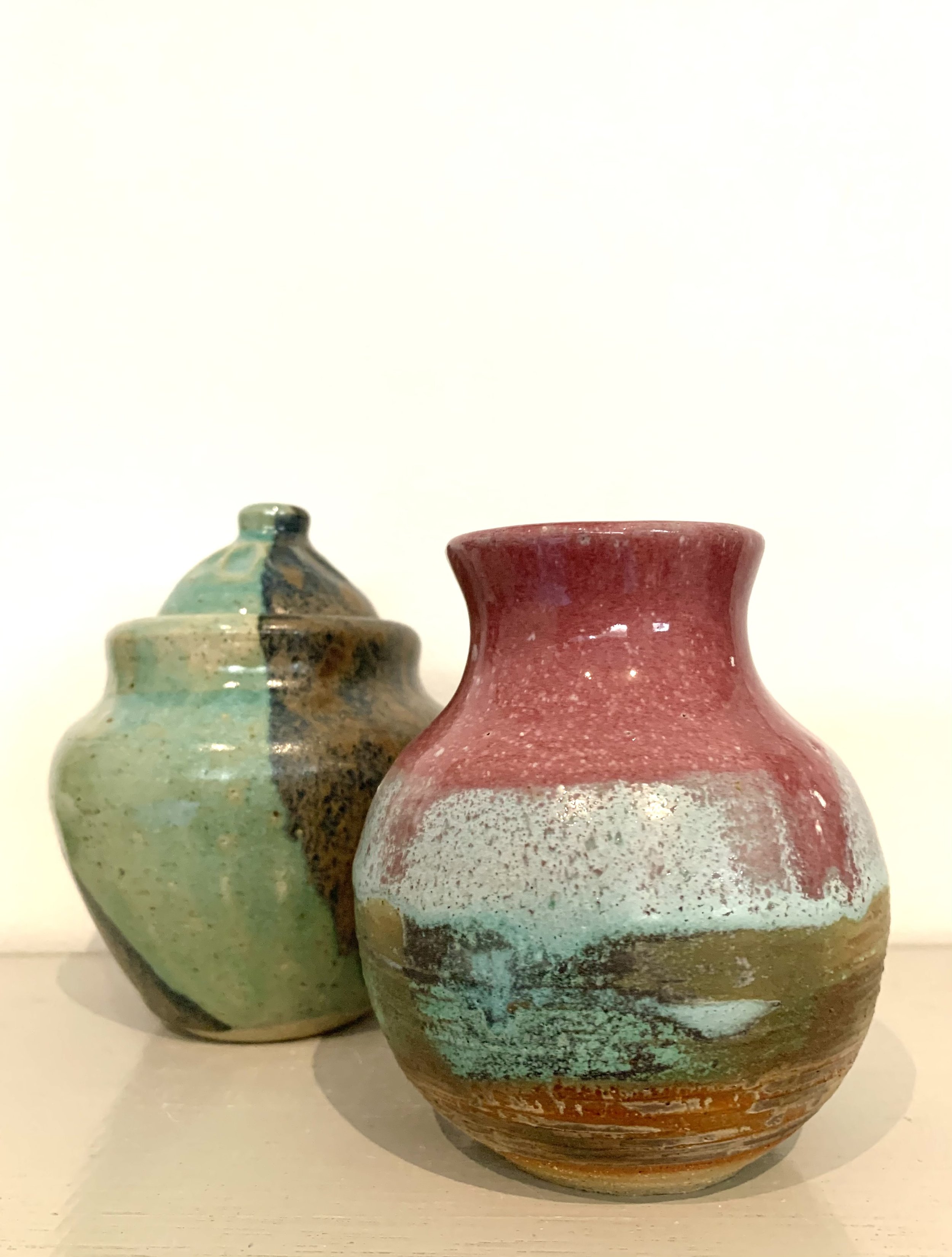Pink stoneware vase with lidded stoneware jar
