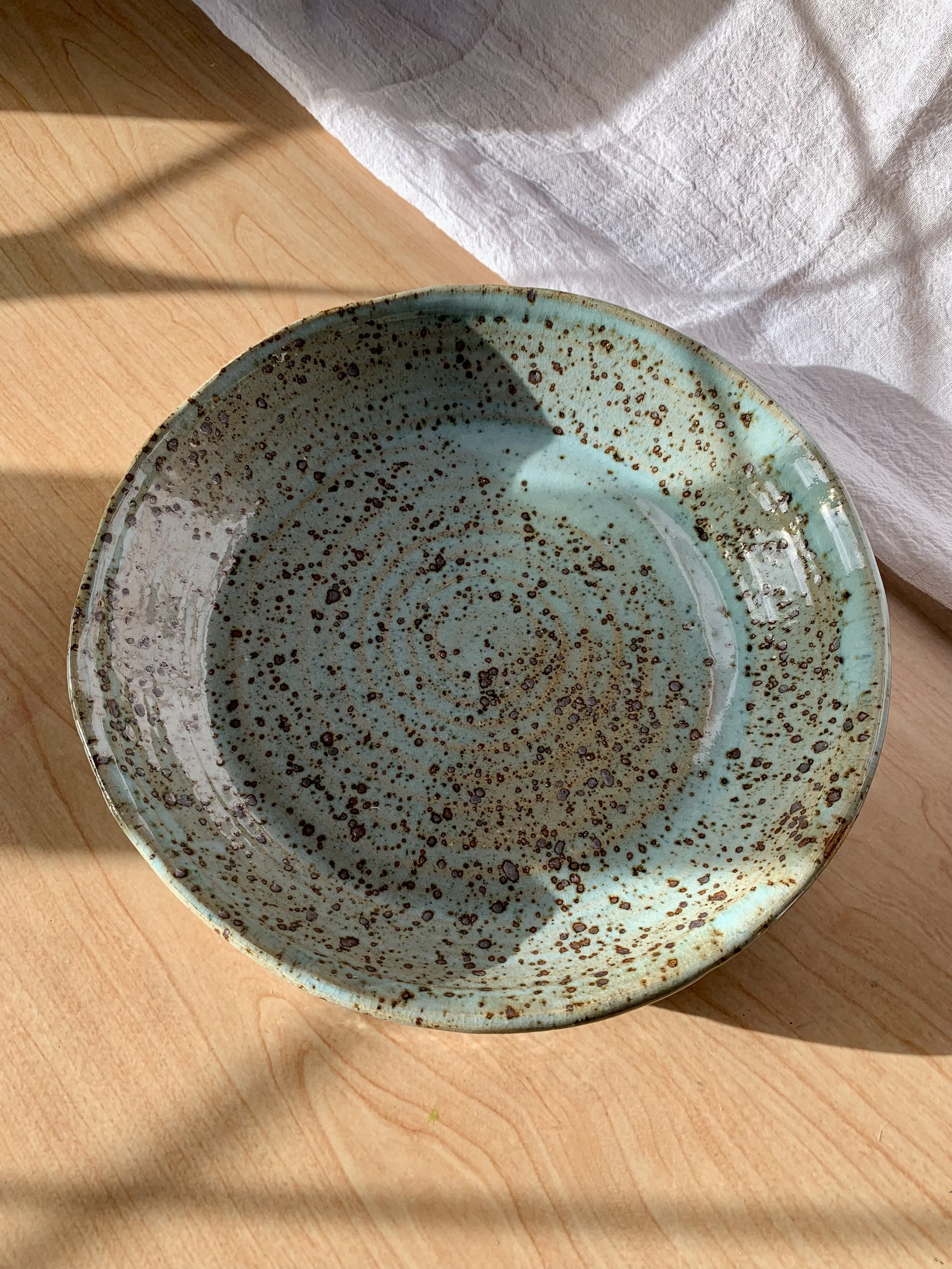 Large serving dish, stoneware with blue Chun glaze, reduction fired.