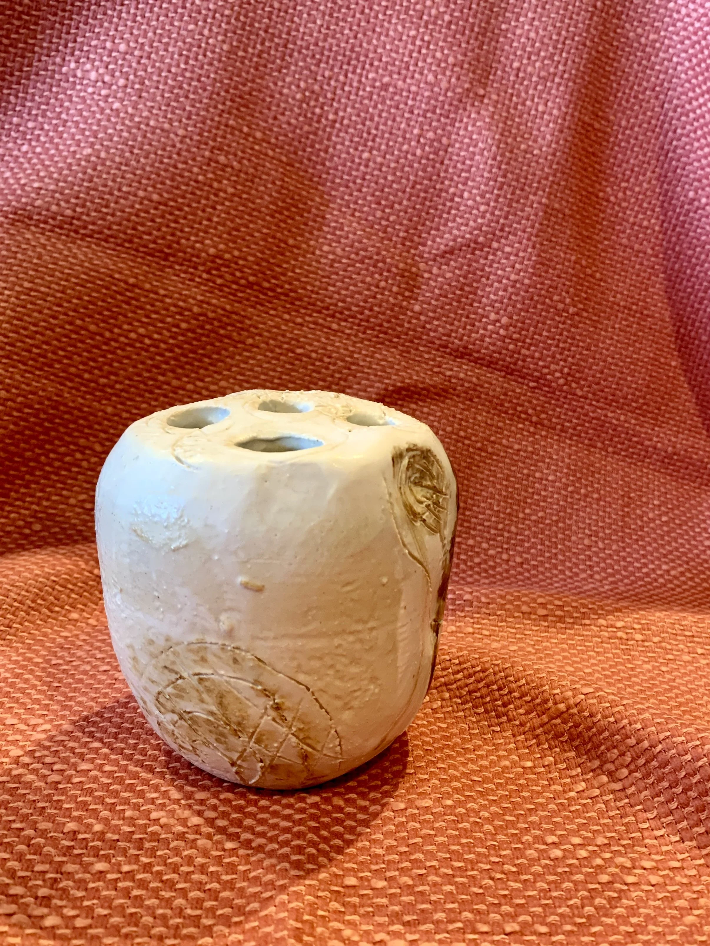 Thrown and altered stem vase with texture and oxide colouring