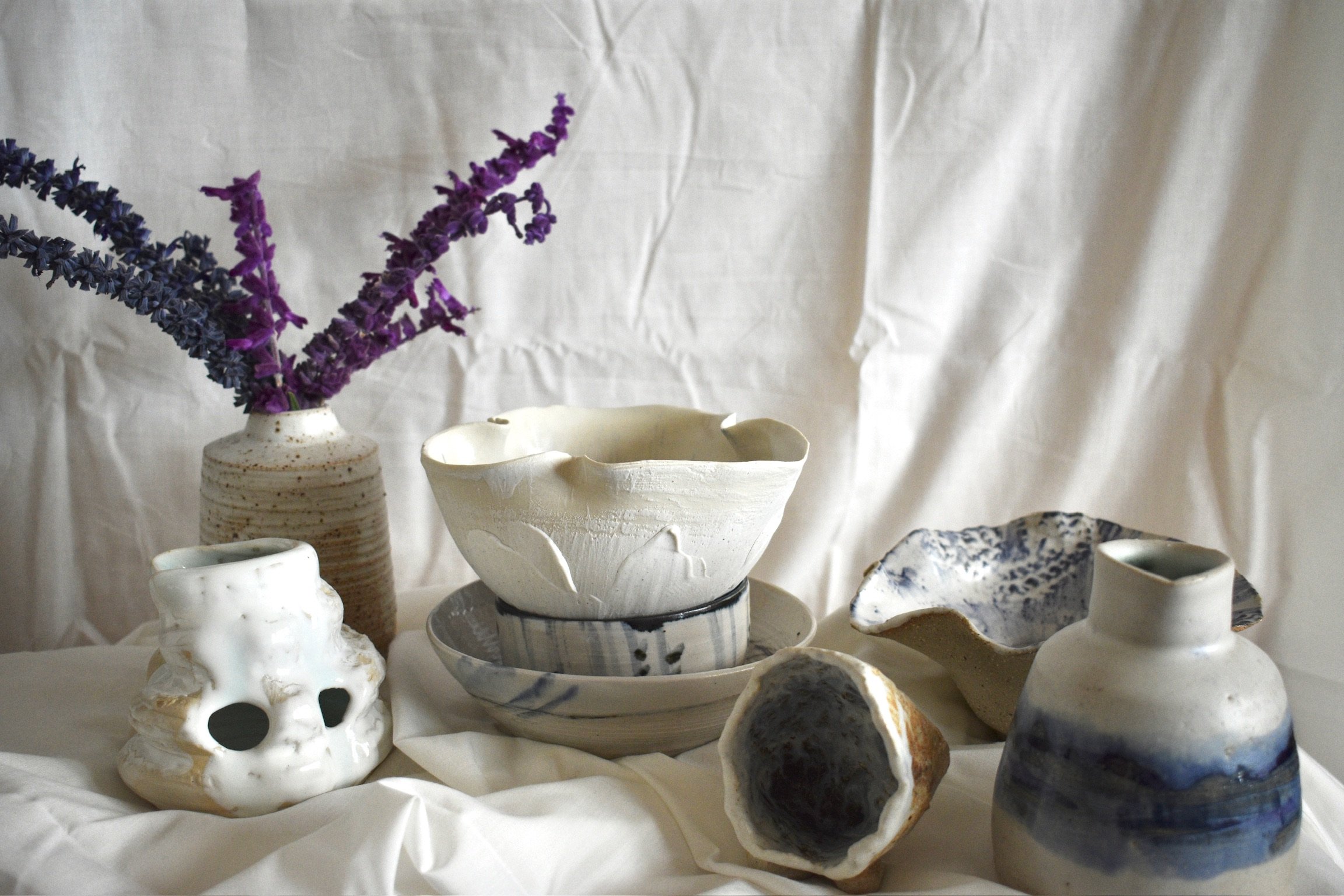 Blue and white bowls, vases, and sculptural forms, stoneware with slips, oxides, and glaze.
