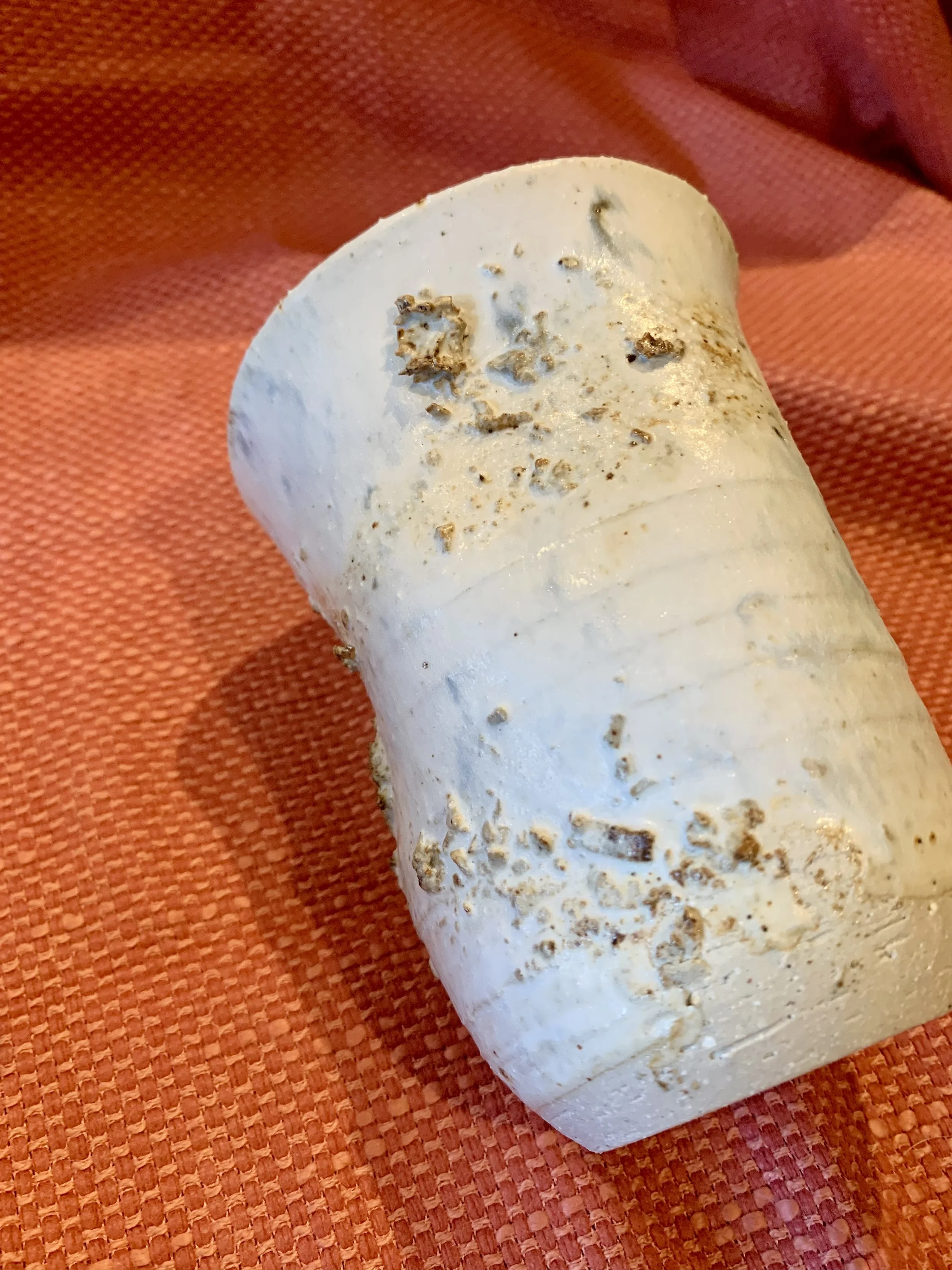 Thrown and altered stoneware vase with texture and oxide colouring