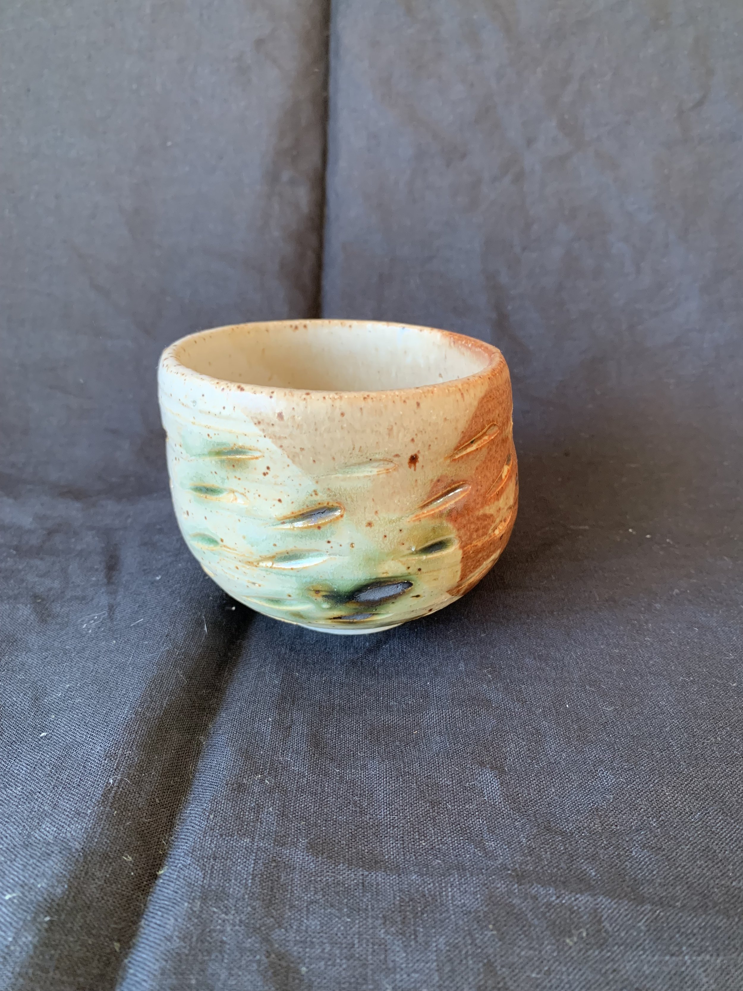 Stoneware cup decorated with oxides made from reclaimed metals