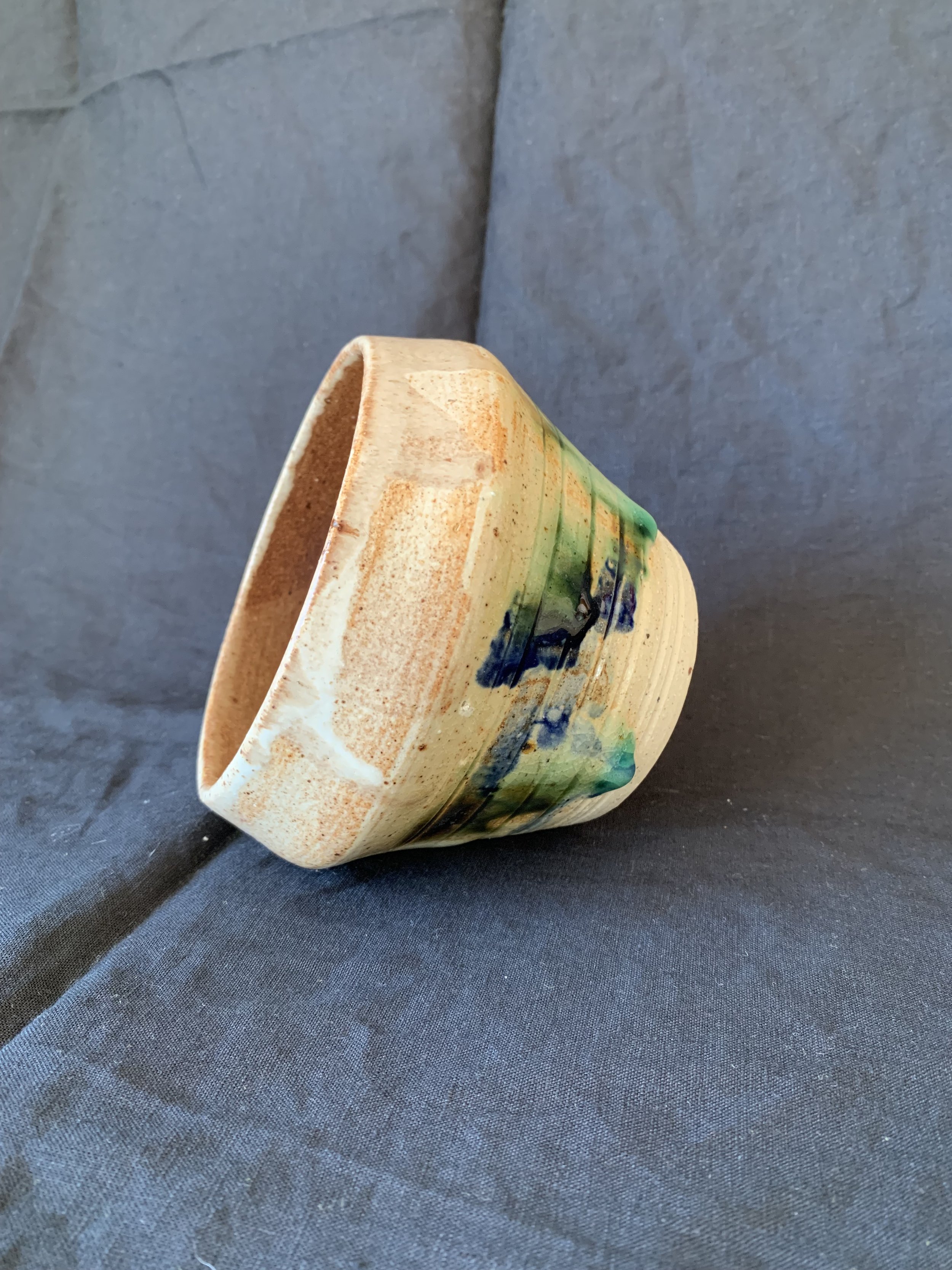 Stoneware vessel decorated with oxides and glazes incorporating reclaimed materials