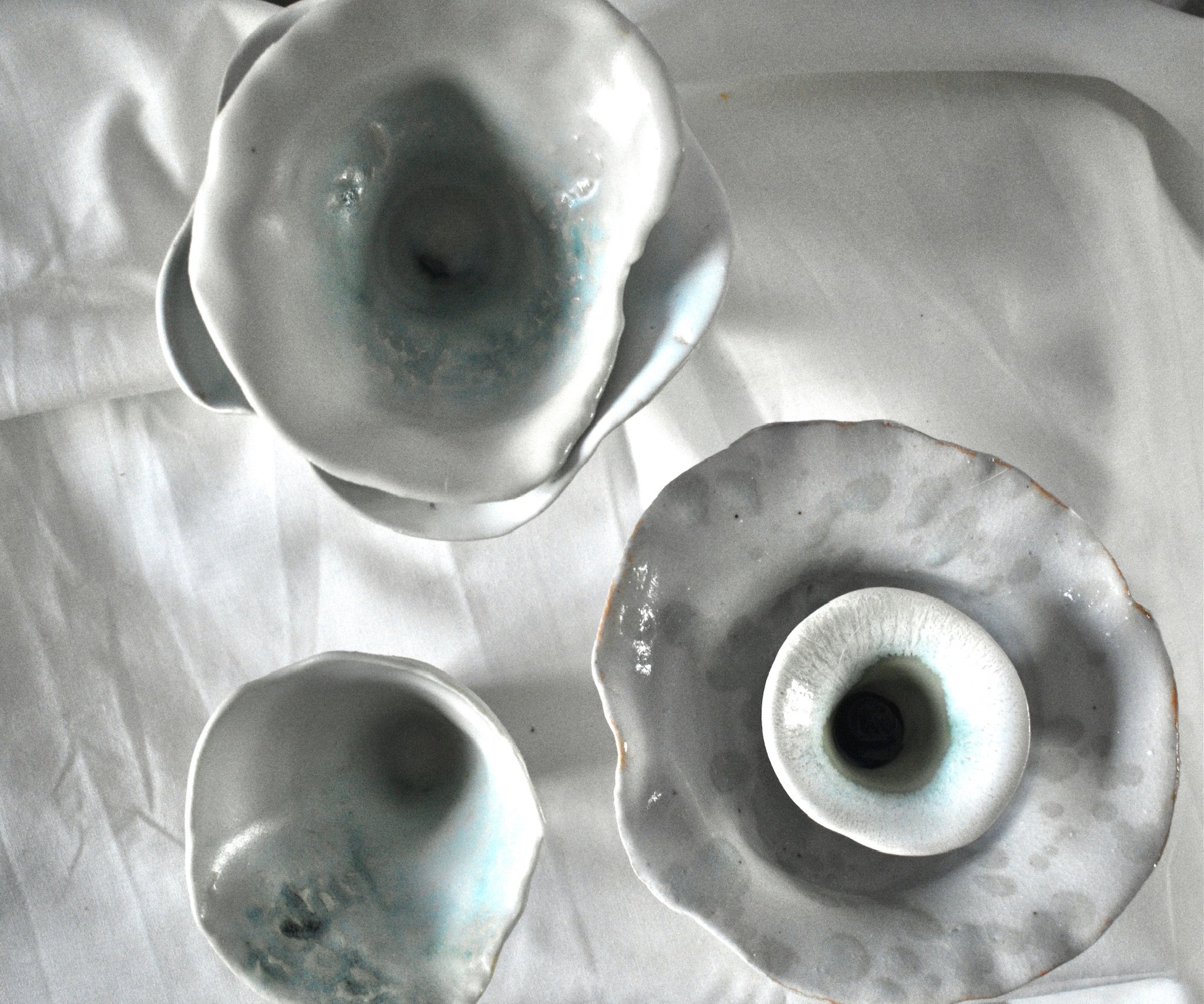 Small shell forms, 2025. Thrown and altered stoneware with slip, oxides, and glaze