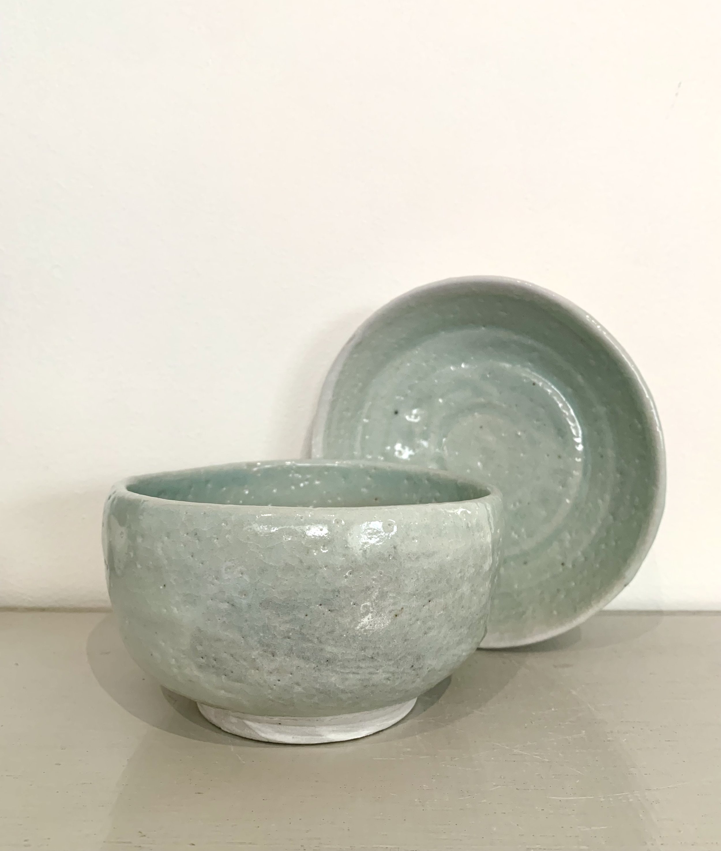 Two medium footed bowls, shino and ash glazed stoneware