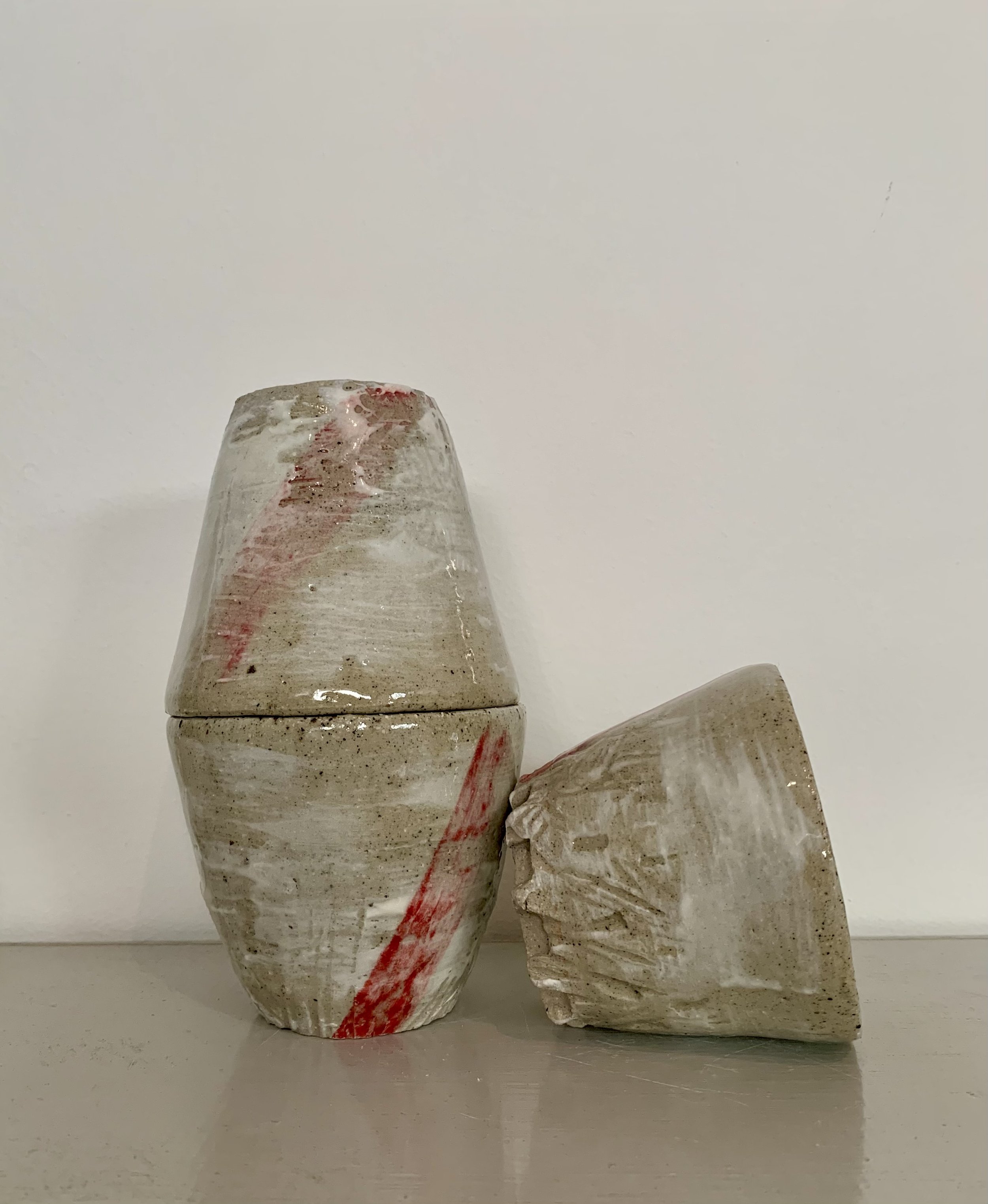 Three slip decorated and carved stoneware tumblers