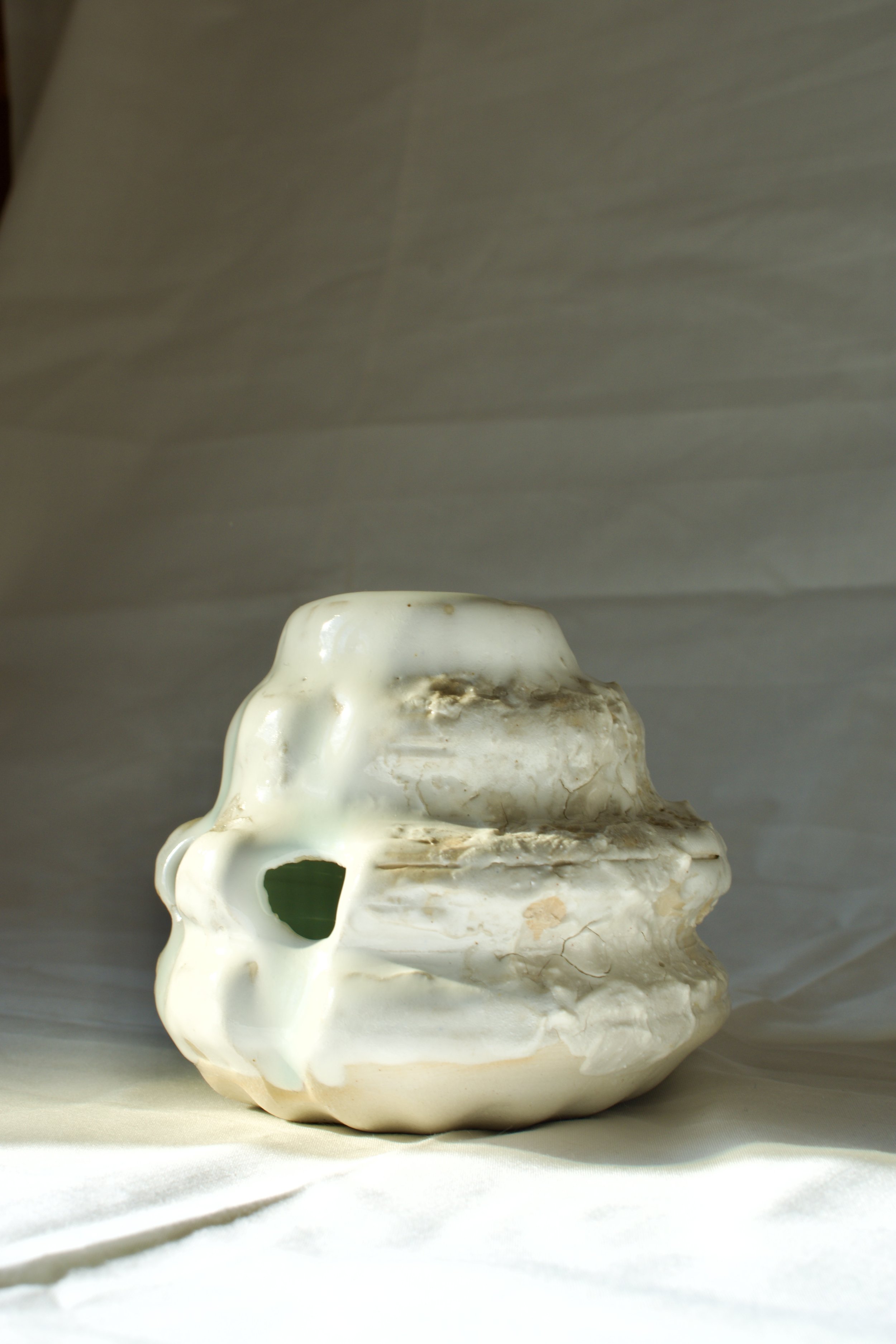 Erosion, 2025. Thrown and altered stoneware with layered slips, engobes, oxides, and glazes.