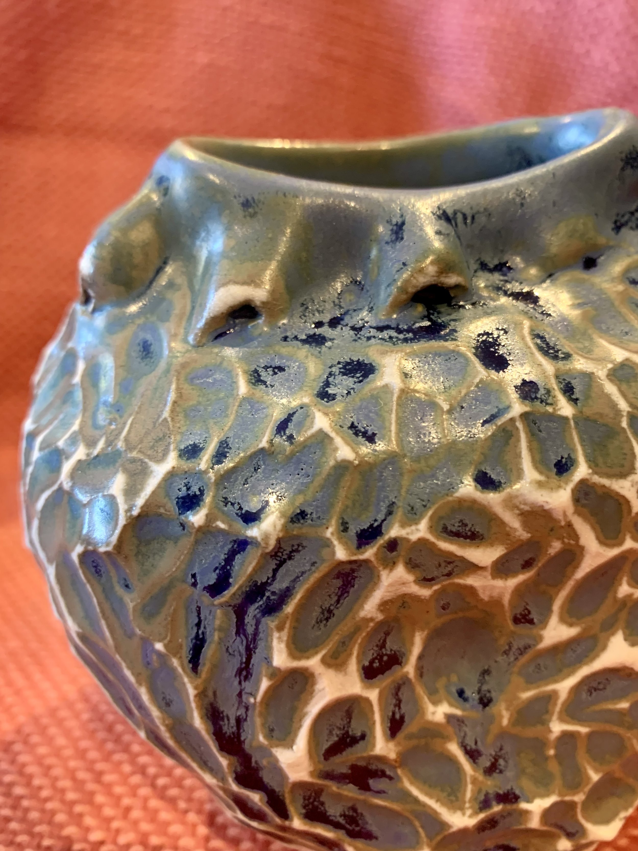 Detail, frill necked and softly faceted thrown and altered vase, glazed stoneware