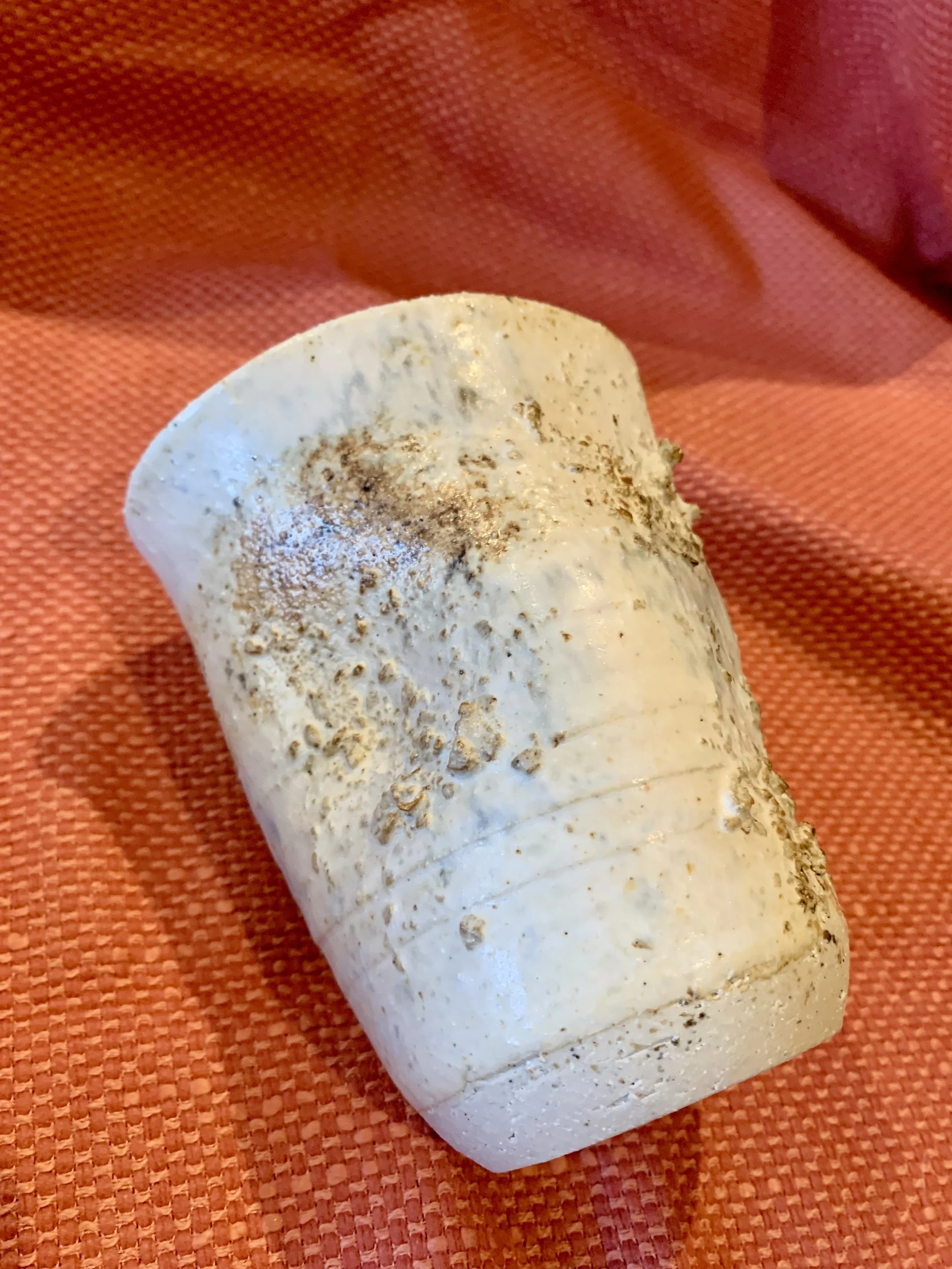 Thrown and altered stoneware vase with texture and oxide colouring