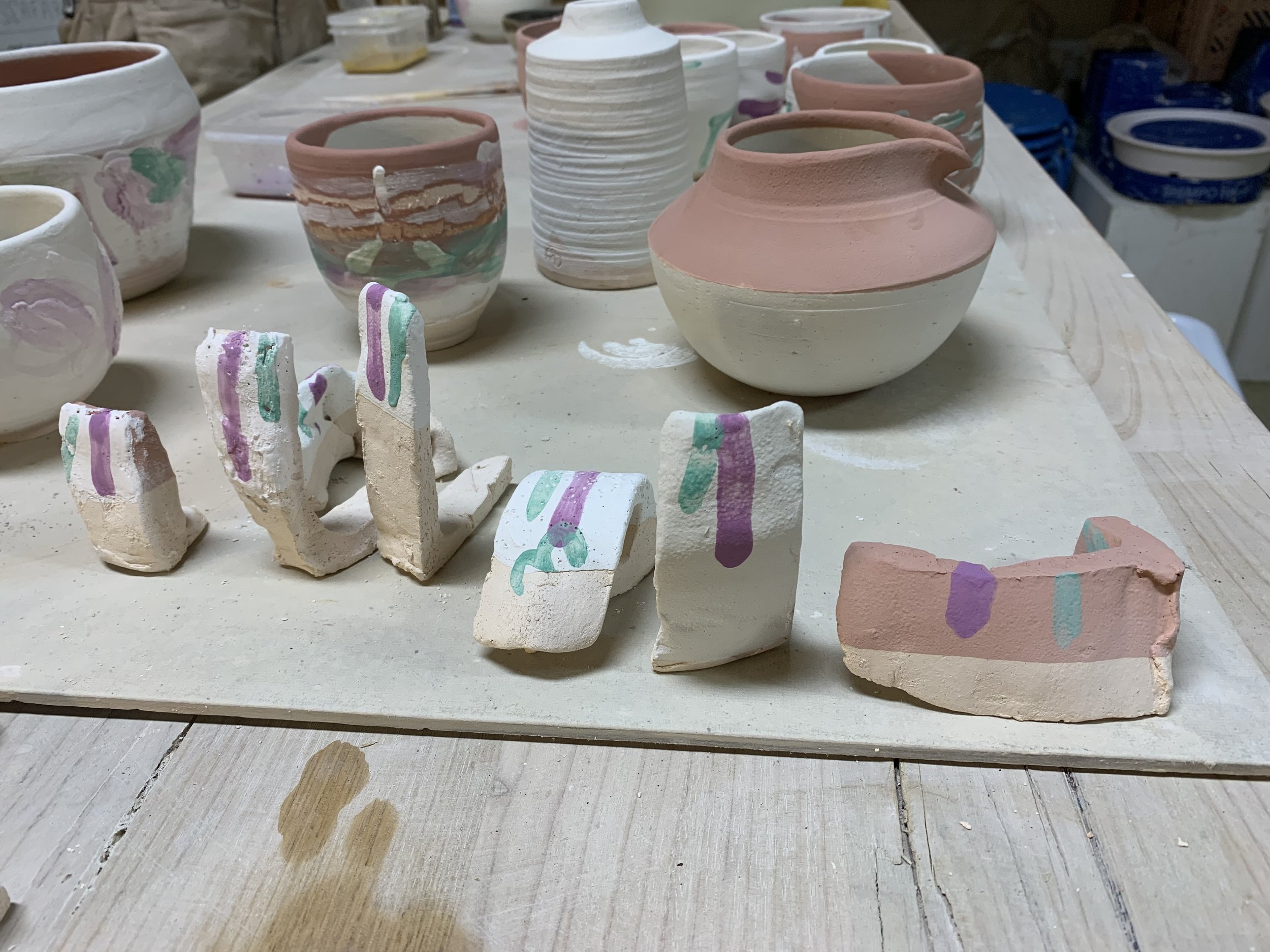Testing glazes and oxides incorporating reclaimed materials on different clay bodies