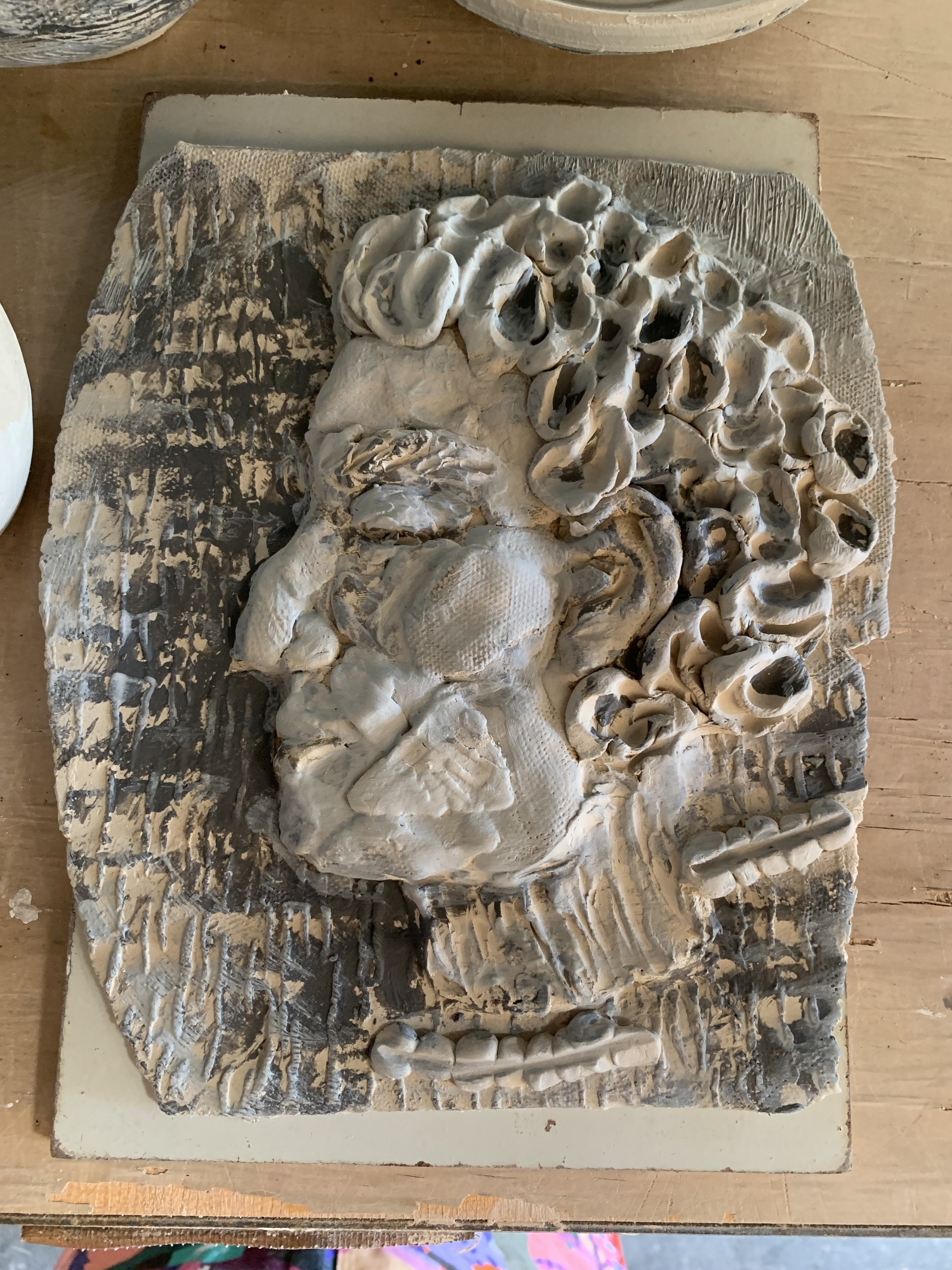 Profile relief in progress, 2024, slip-decorated stoneware