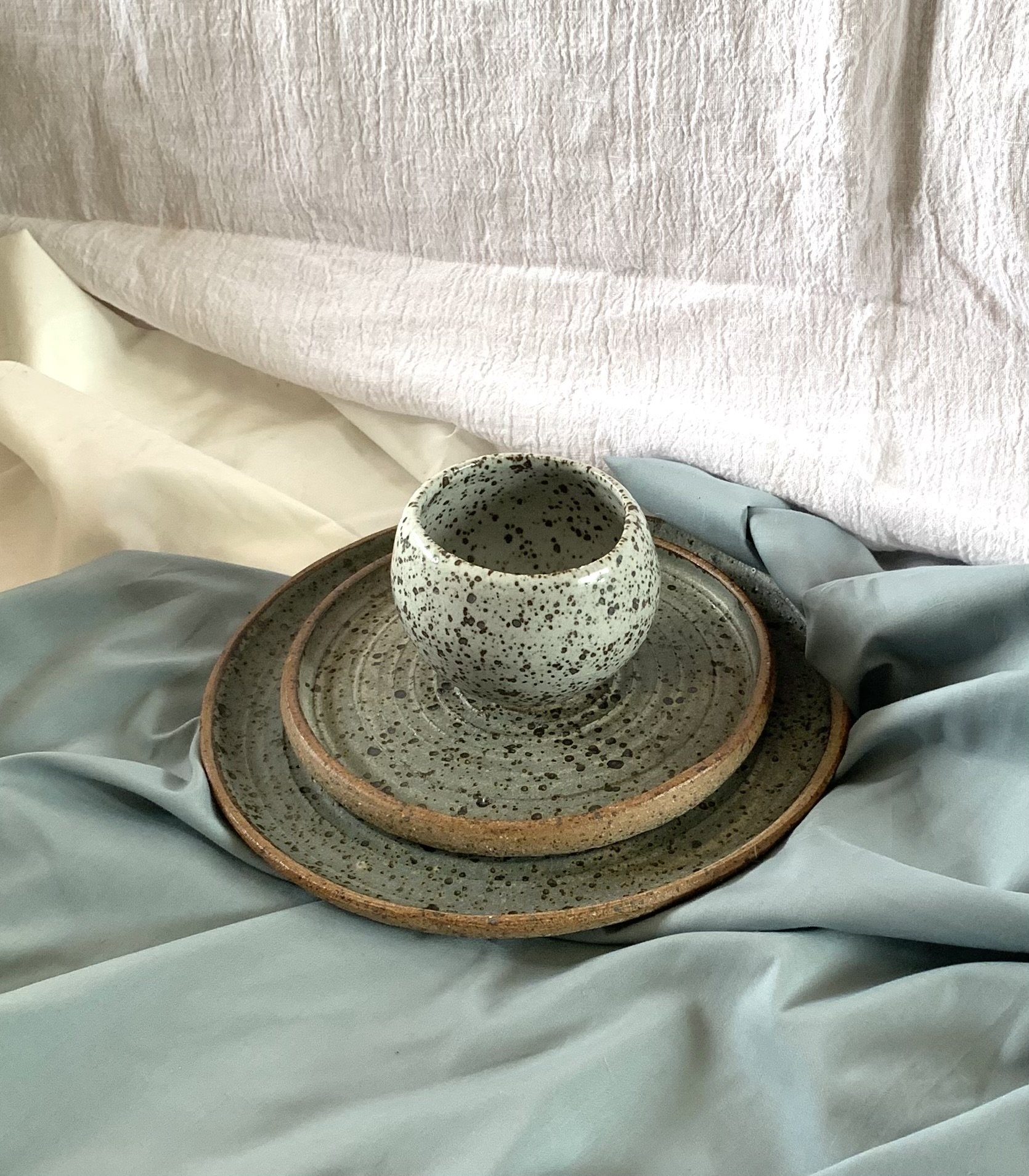 Small footed bowl, side plate, and dinner plate, reduction fired stoneware