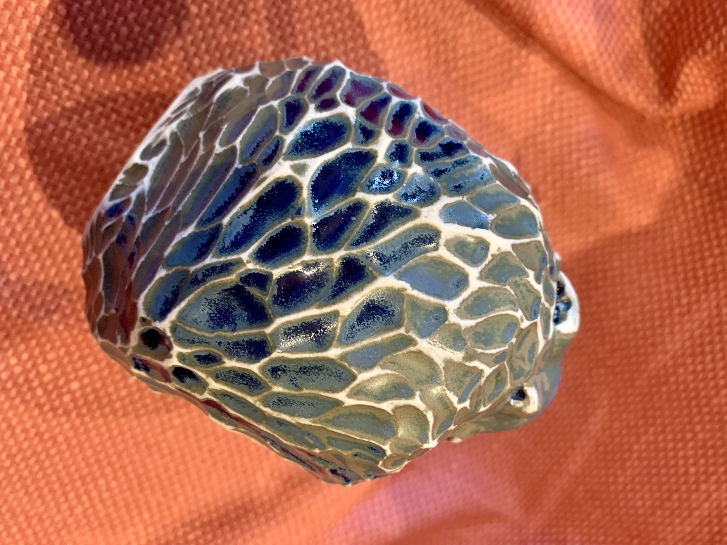Detail, frill necked and softly faceted thrown and altered vase, glazed stoneware