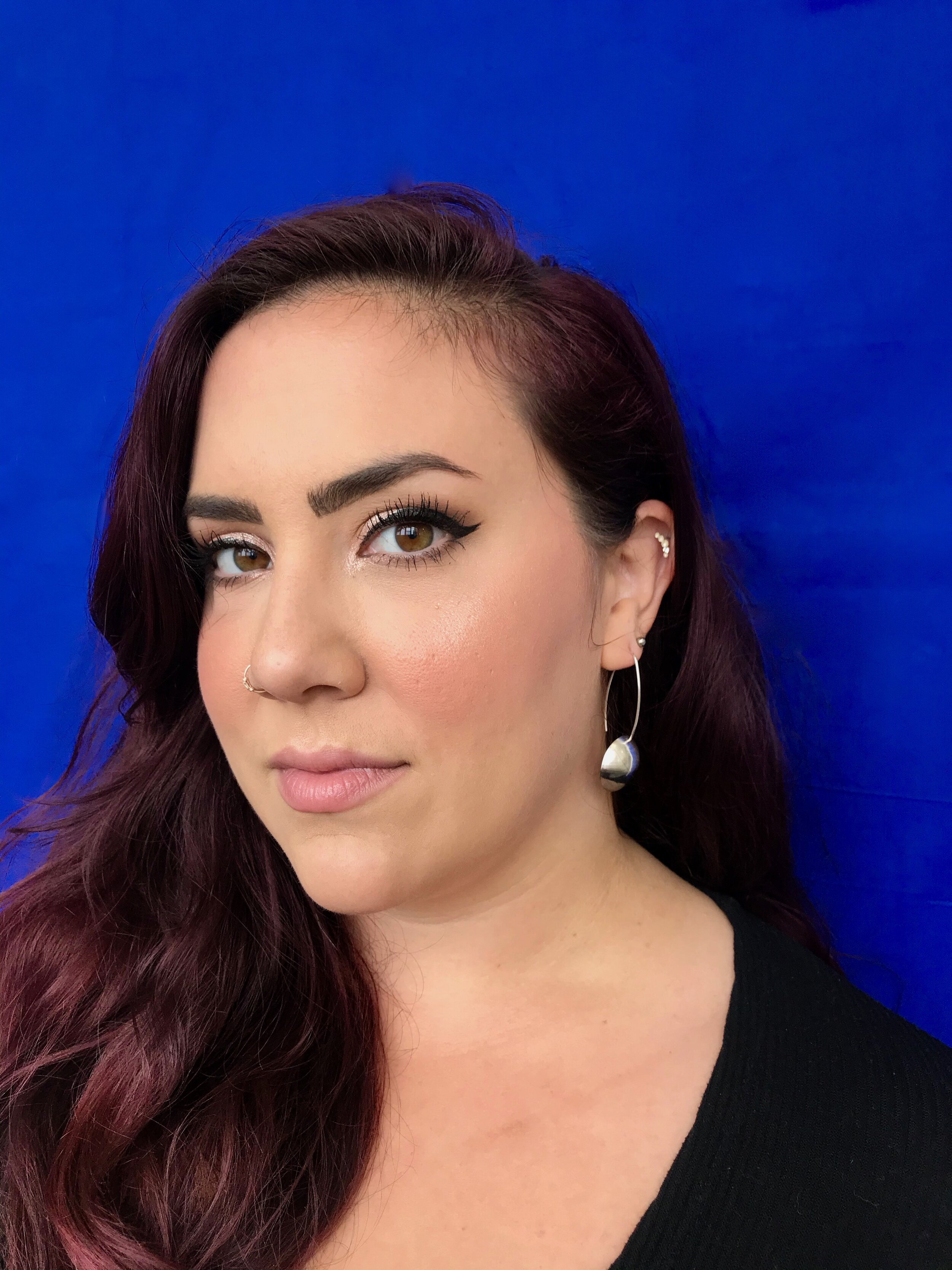 Bombshell wearing Harmony Half Moon Earrings