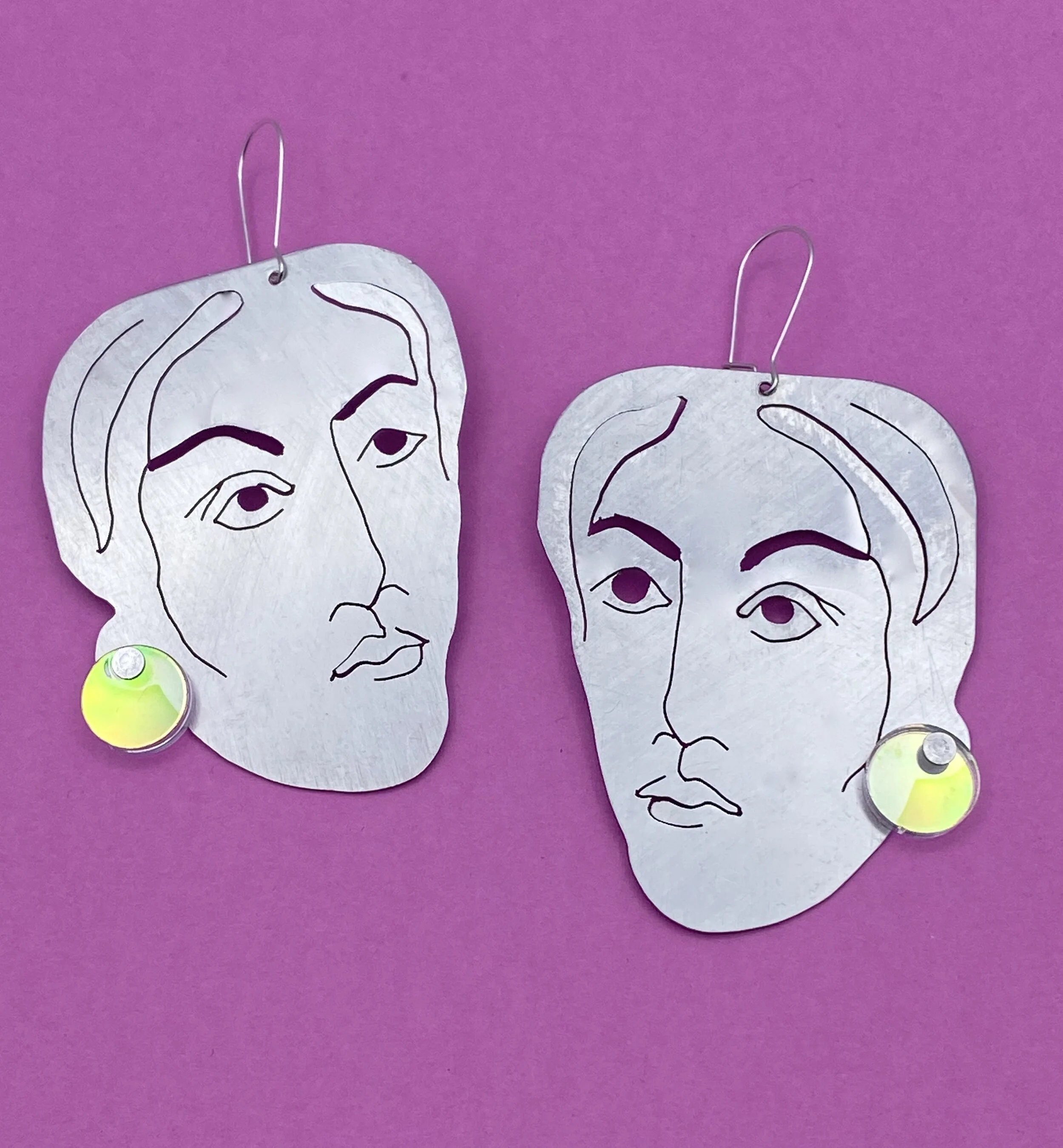 DE face earrings.jpeg