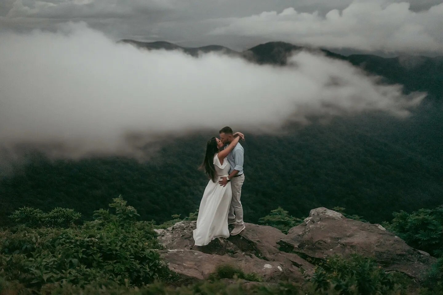Man, you just never know what kind of weather you're going to get in the mountains.

Caris + Aaron braved the storm as we hiked to the top.  We had to wait out the rain under our umbrellas and my changing tent and squeezed in photos when we could.  F