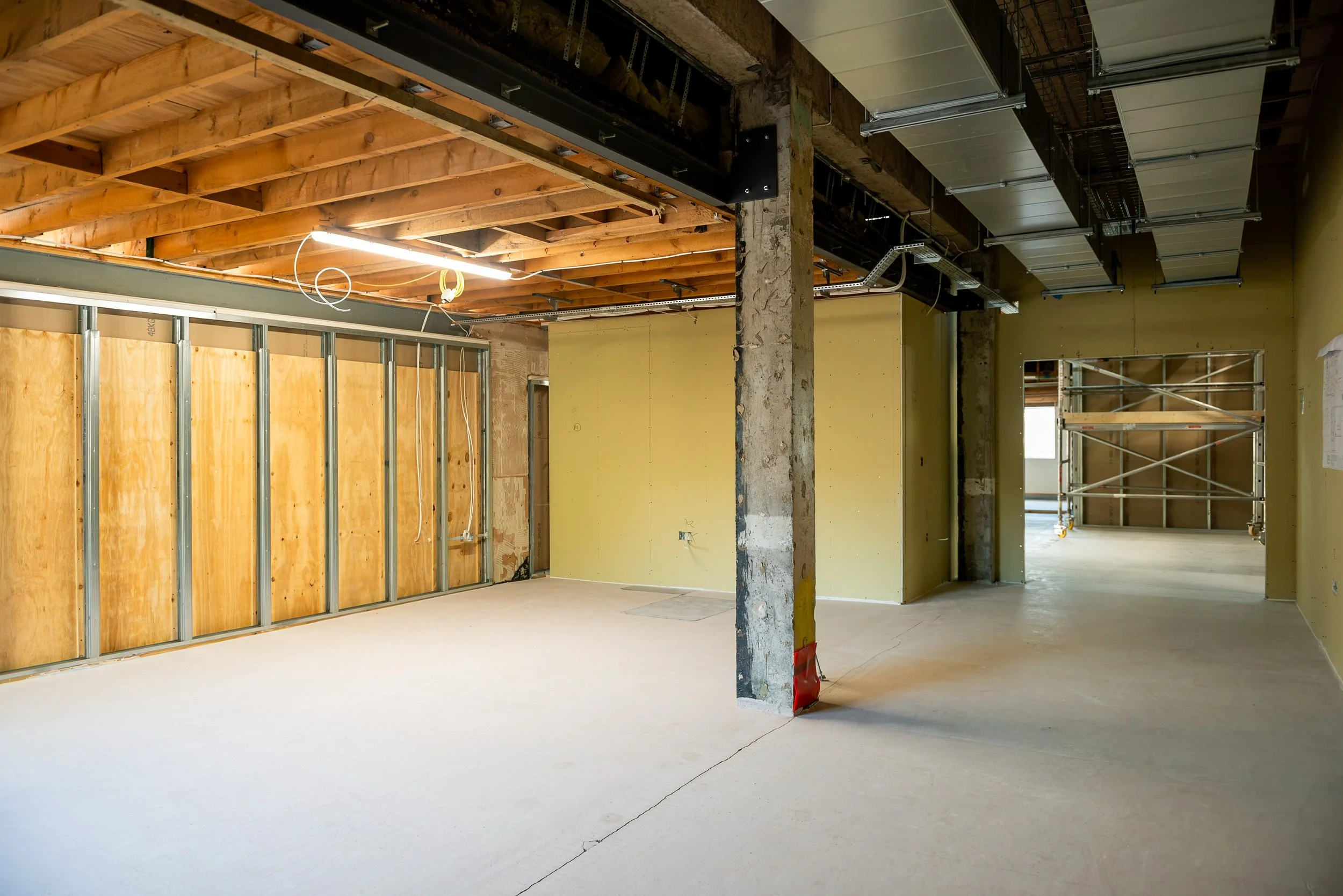 Fully boarded room with silver ductwork and riser. Fully boarded activity room with ventilation ductwork installed, ready for taping and filling