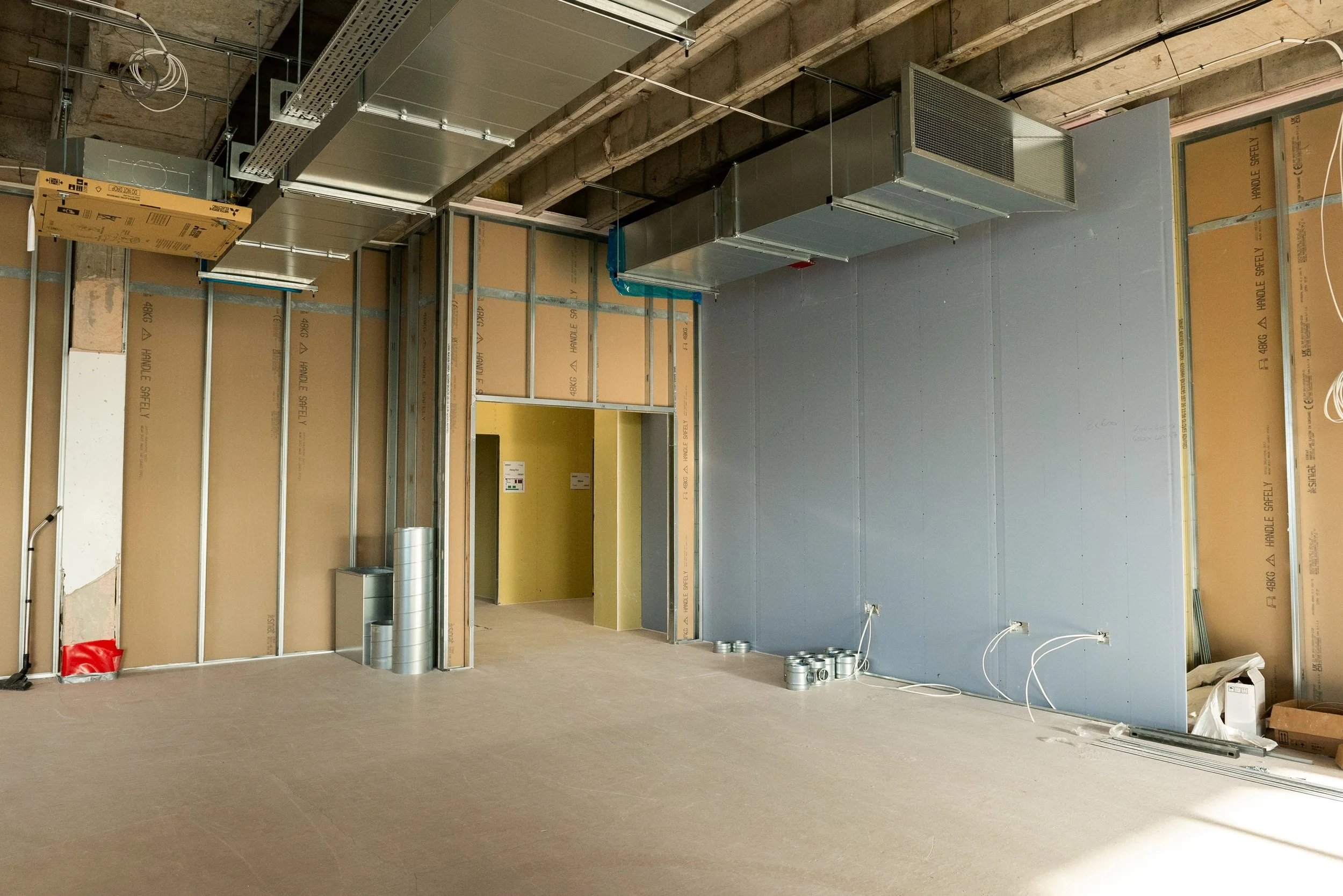 Plywood lining fixed behind metal studwork to provide solid fixings for specialist equipment