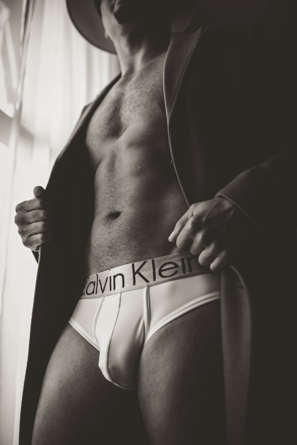 black-and-white-boudoir-portrait-of-man-in-calvin-klein-underwear-and-blazer.jpg