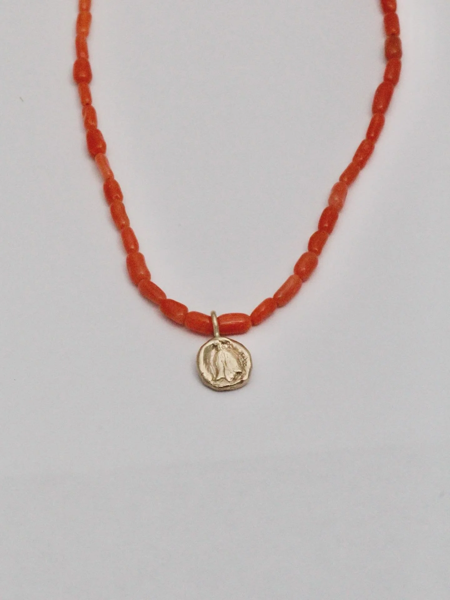 New rose talisman necklace, with vintage angel coral beads. 🌹

When I got these coral beads, I knew they wanted to be paired with a rose pendant. To me, the rose bud represents the sacred feminine, and our ability as women to be soft and strong at t