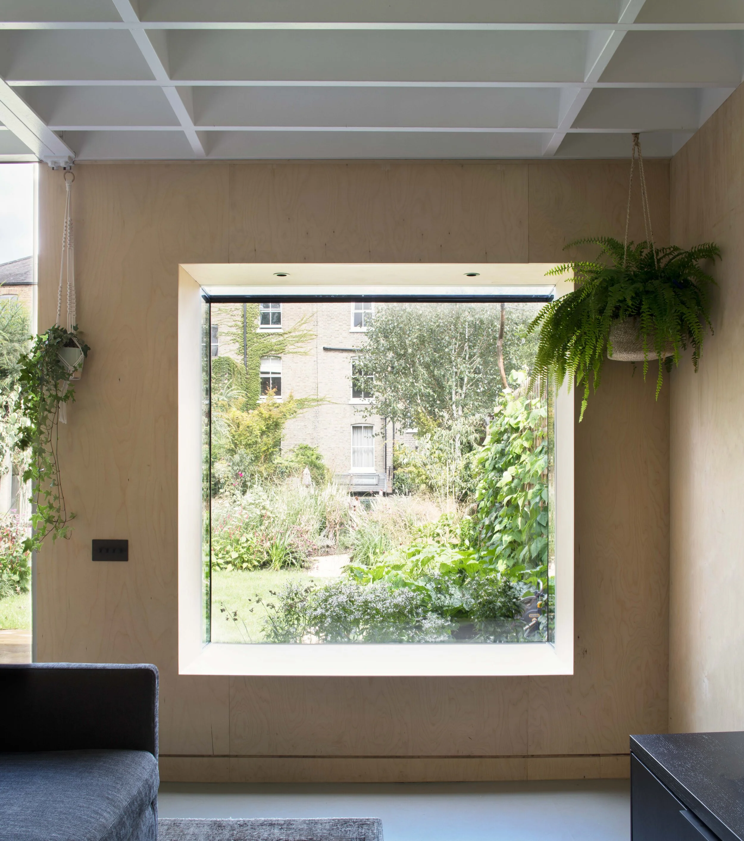 Eco-friendly home in London using raw materials and timber to create a garden annex in London.