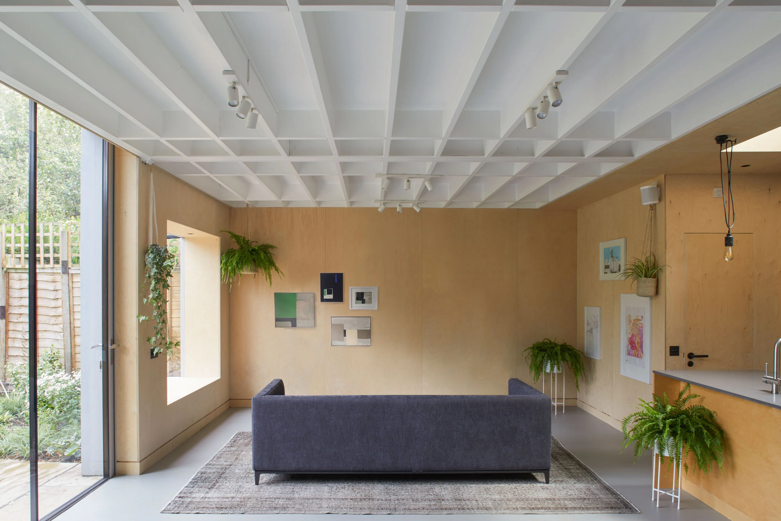 Interior designers in London create garden annex with sliding doors in London.