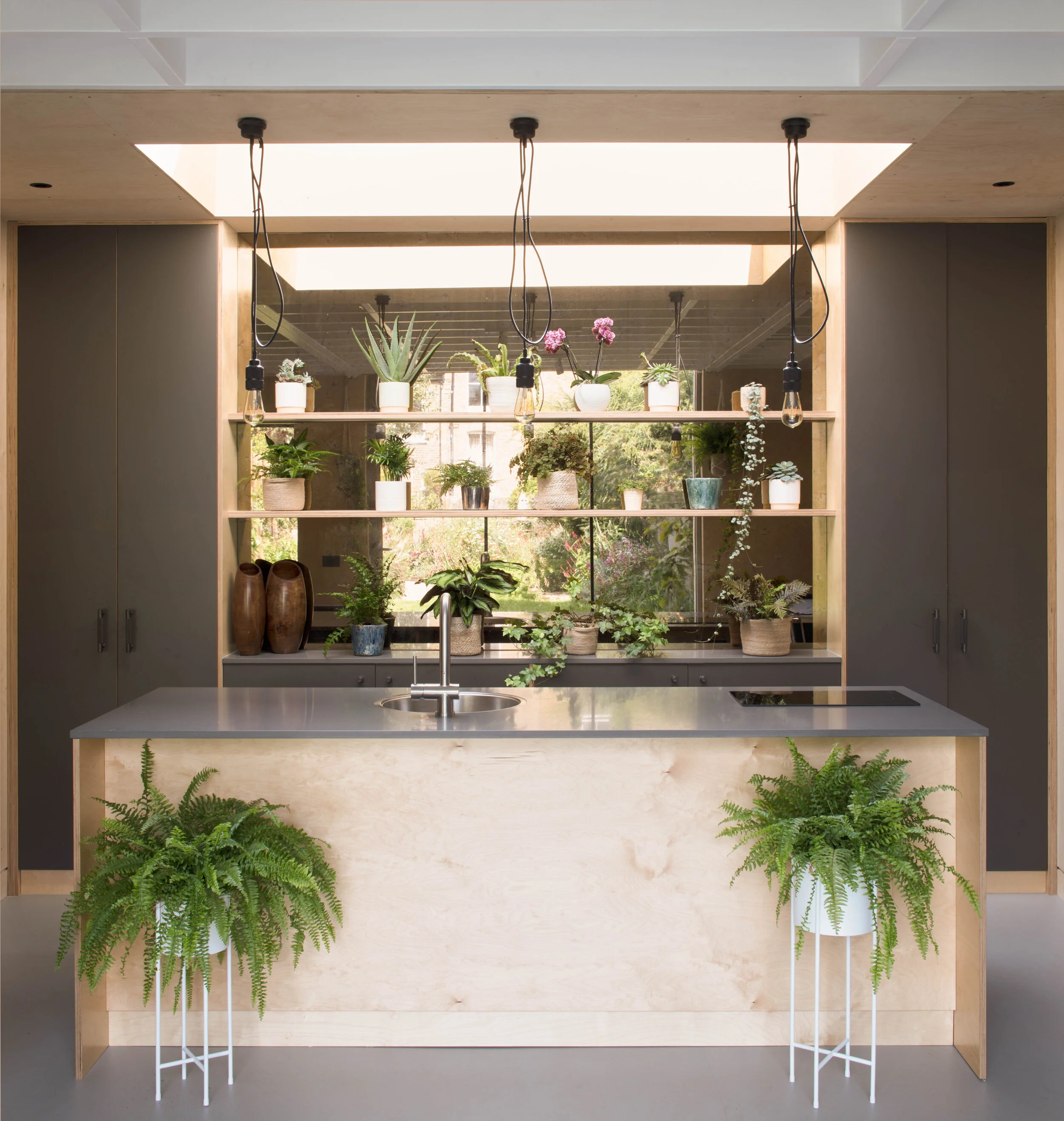 London based interior designers use timber to create modern kitchen. Interior design ideas in London.