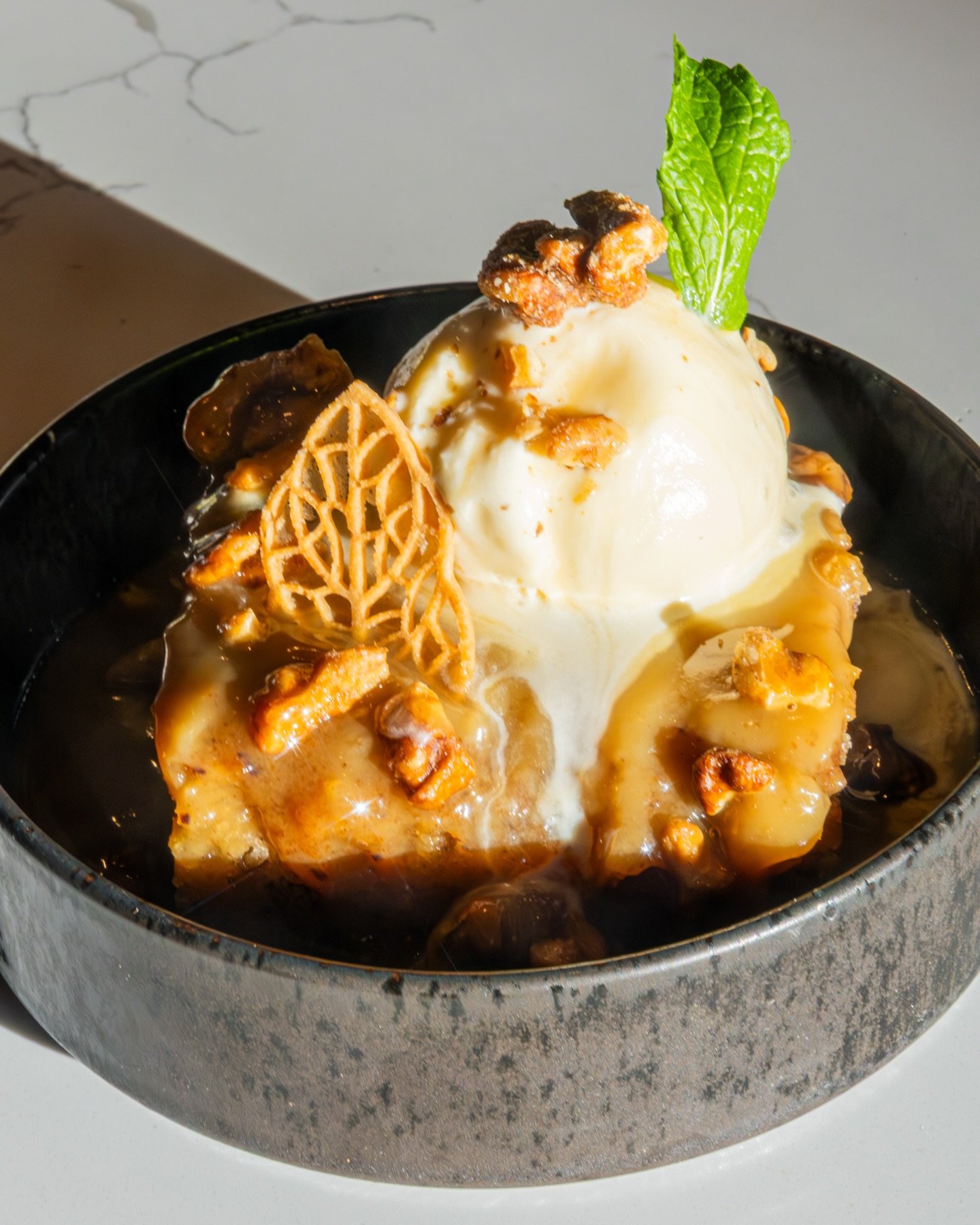 Savor the delightful flavors of the holiday season with Barrel &amp; Derrick's Sticky Toffee Butter dessert. Crafted with rich brown butter caramel, crunchy candied walnuts, and smooth vanilla ice cream, this treat is sure to be an excellent compleme
