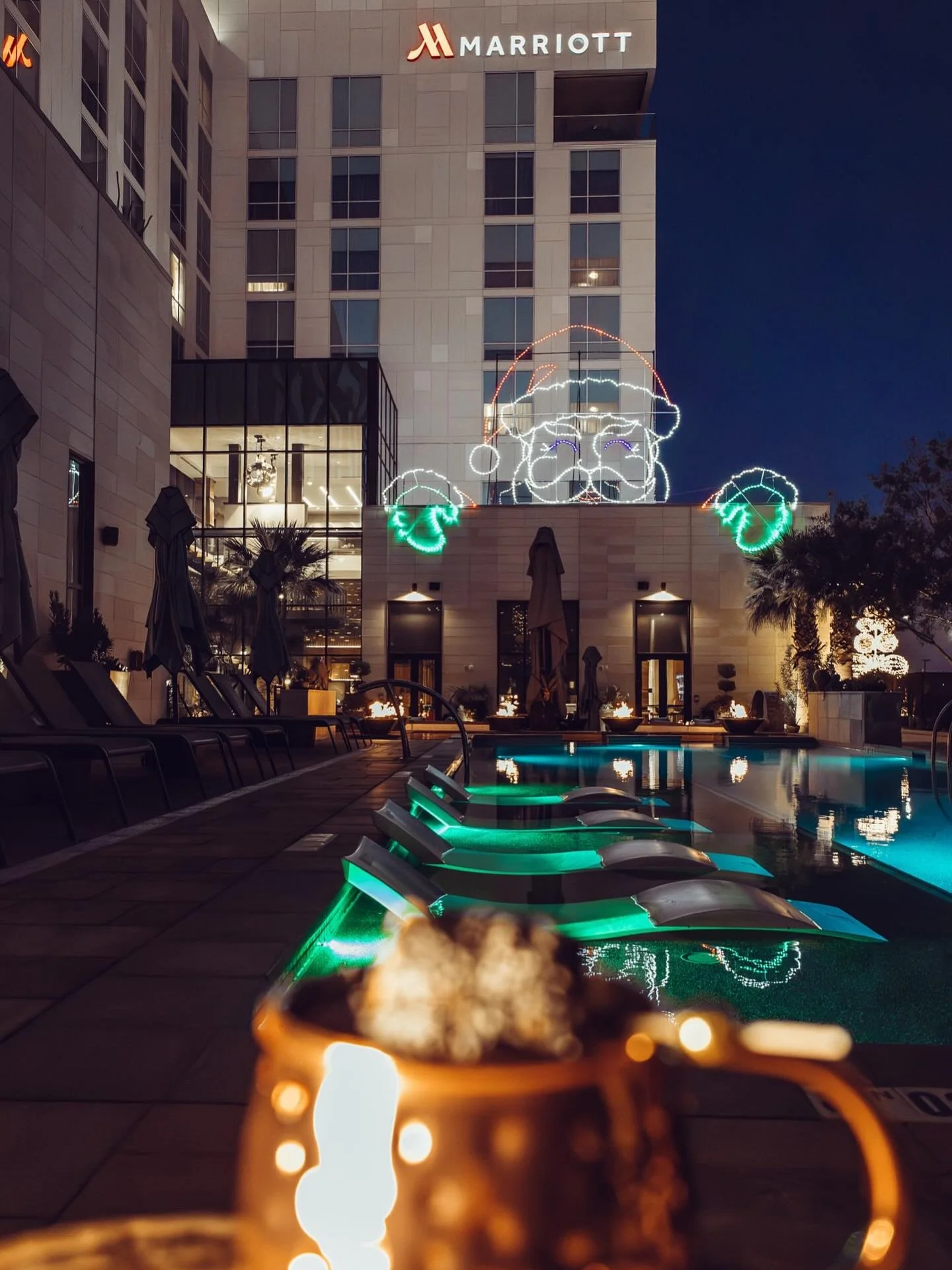 Relax and savor the stunning night views from the poolside while sipping your favorite cocktail.
