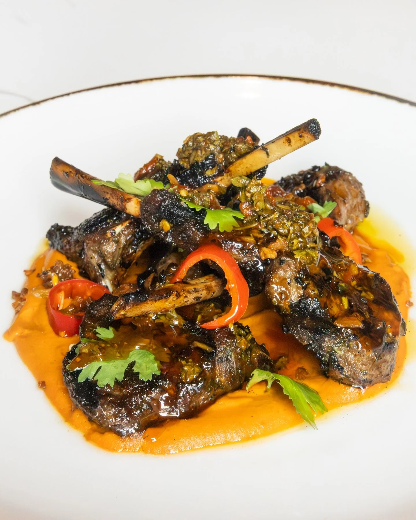 Make Barrel &amp; Derrick your next date night spot. With an exceptional menu crafted to delight every palate, we invite you to experience an evening of culinary excellence and friendly hospitality.

Savor our signature Grilled Lamb Lollipops, skillf