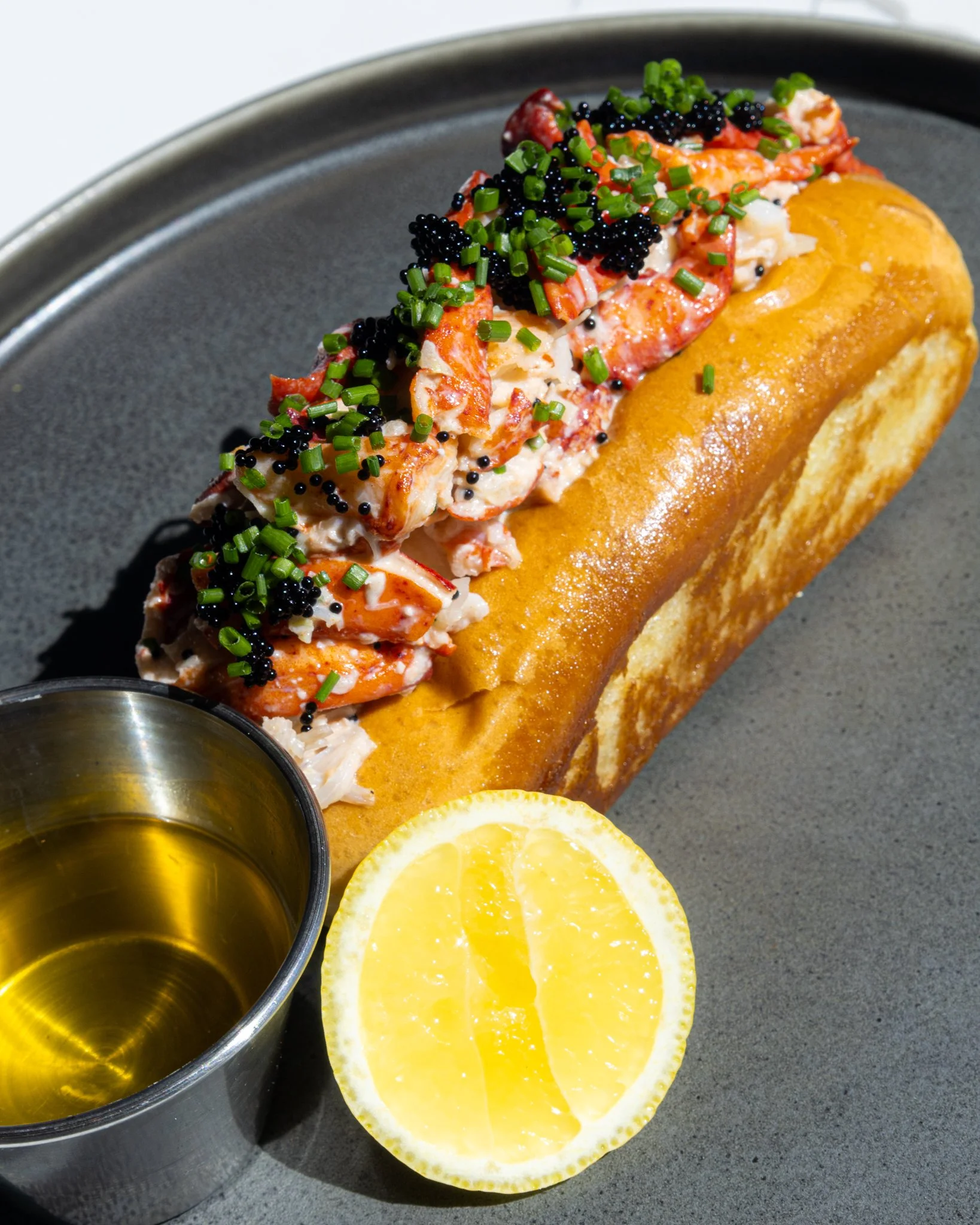 Sink your teeth into Barrel &amp; Derrick&rsquo;s New England Lobster Roll made with Kewpie mayo, lemon, chives, and tobiko.  Make your reservations today!
