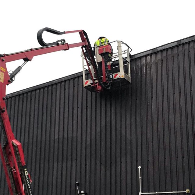 Our cherry picker out working helping a roofing company repair a roof