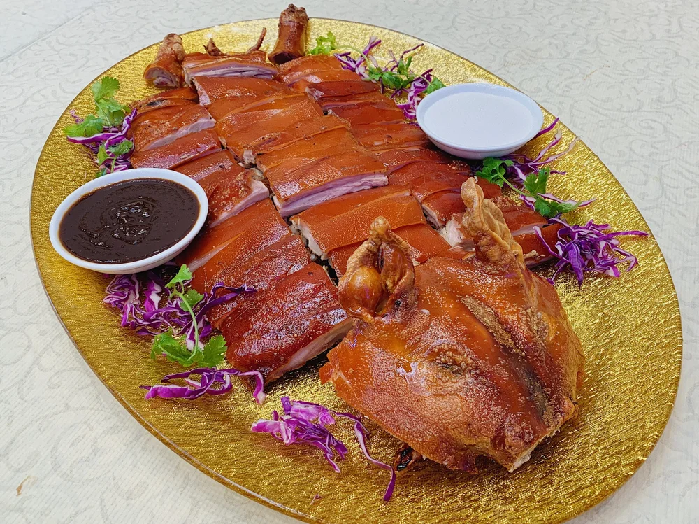 Whole Roasted Suckling Pork 炭烧脆皮乳猪 Welcome To H L Peninsula Restaurant