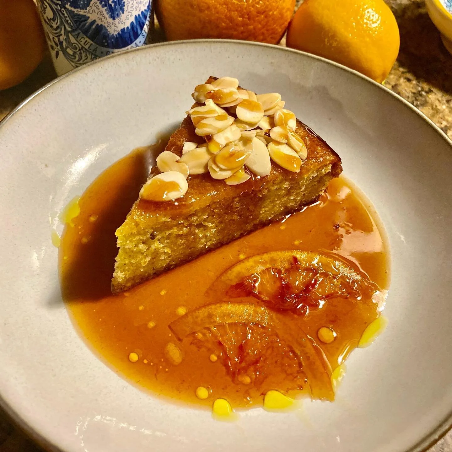 Meyer lemon &amp; blood orange olive oil cake wish a blood orange reduction and toasted almonds