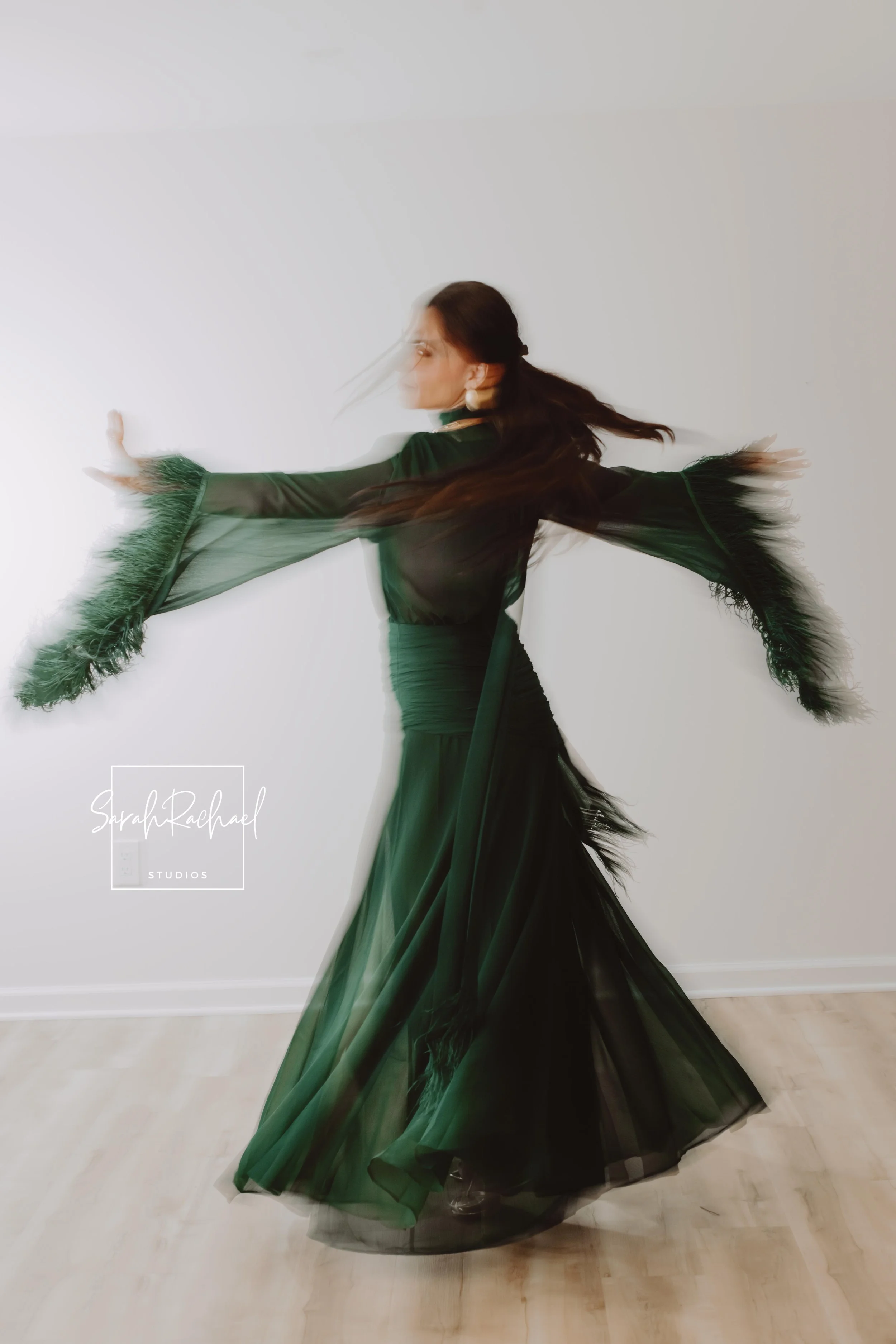 Influencer model twirling during an editorial fashion photoshoot at SarahRachael Studios in Frederick, Maryland.