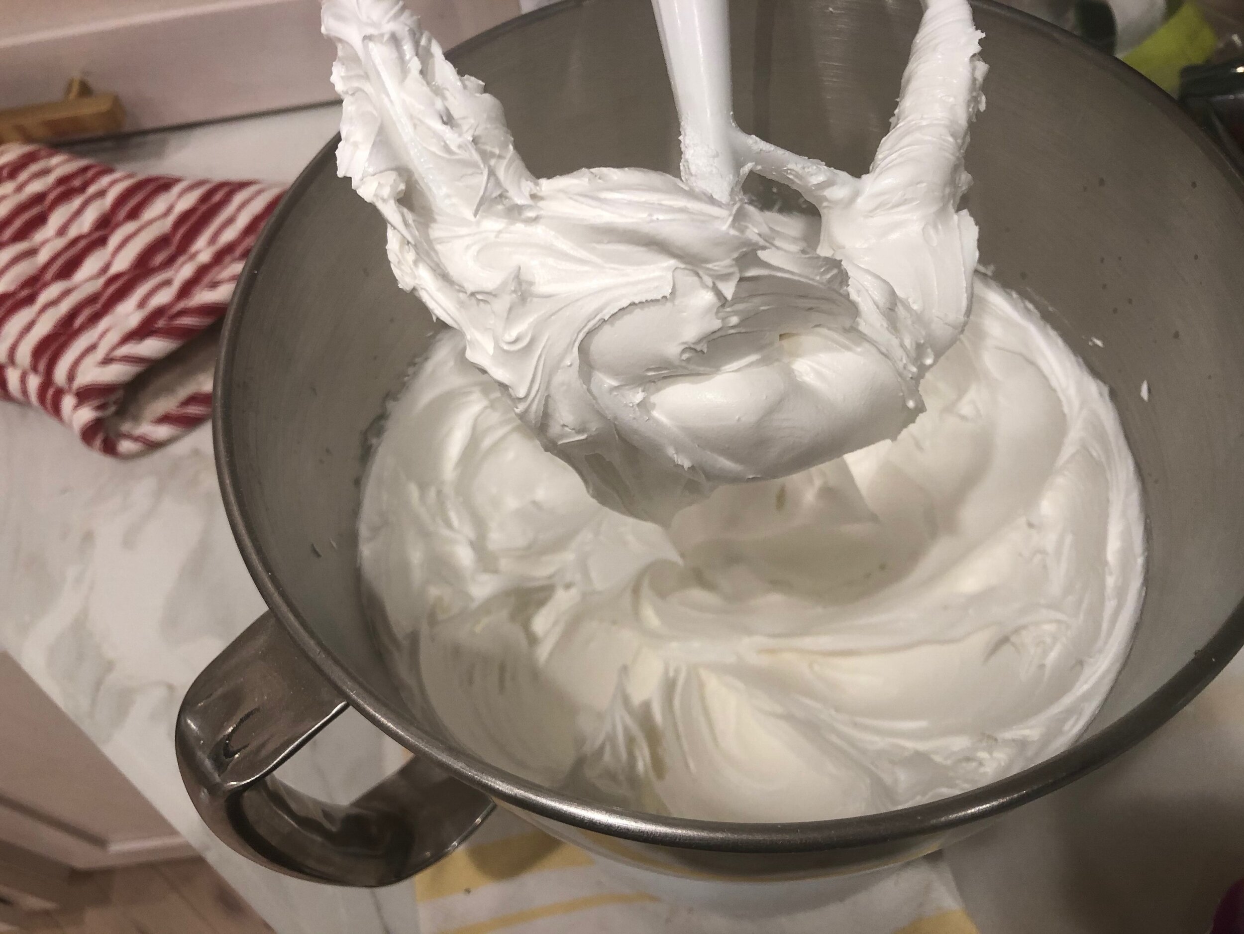  Mix on medium high for about 4 minutes. After 4 minutes this is what the icing will look like with stiff peaks. The icing sticks to the paddle. 