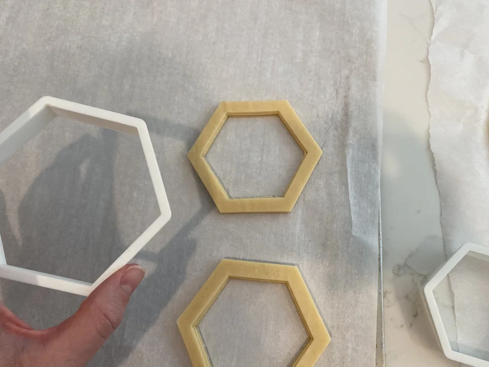  Gently remove the large cookie cutter gently pressing the dough down so it doesn’t lift with the cookie cutter. 