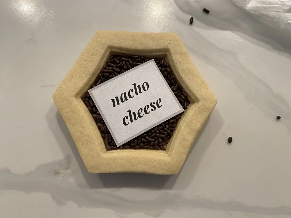  Add your message on top of the sprinkles.  For these cookies I was making dad jokes so I put the punchline inside the cookies. 