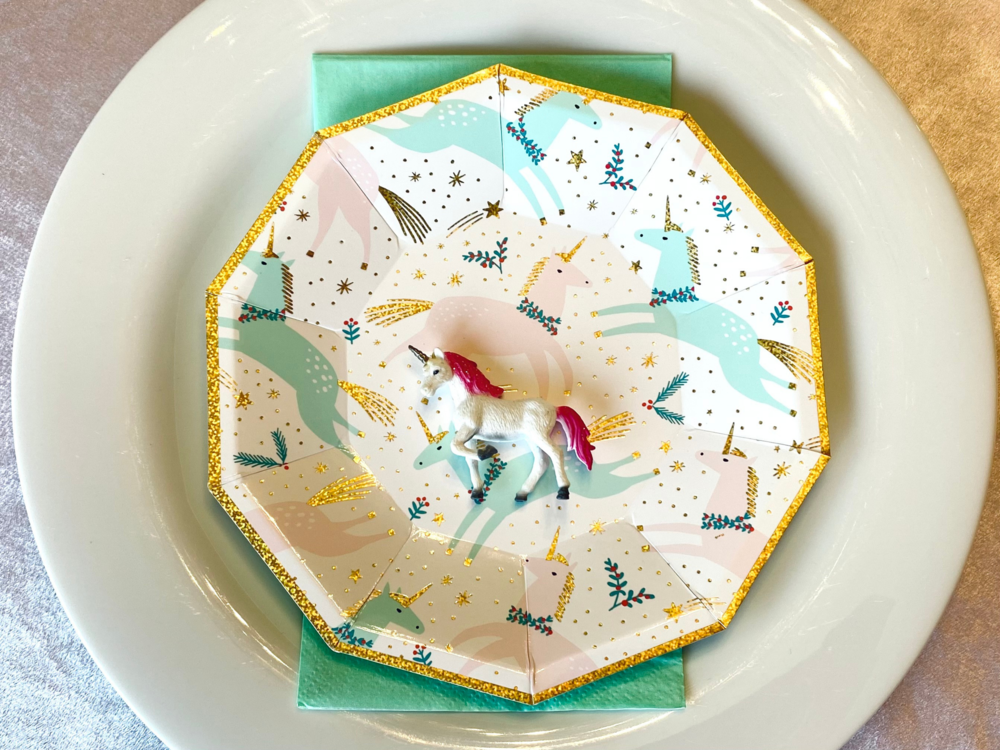 These Christmas and unicorn plates were the inspiration for the party. 