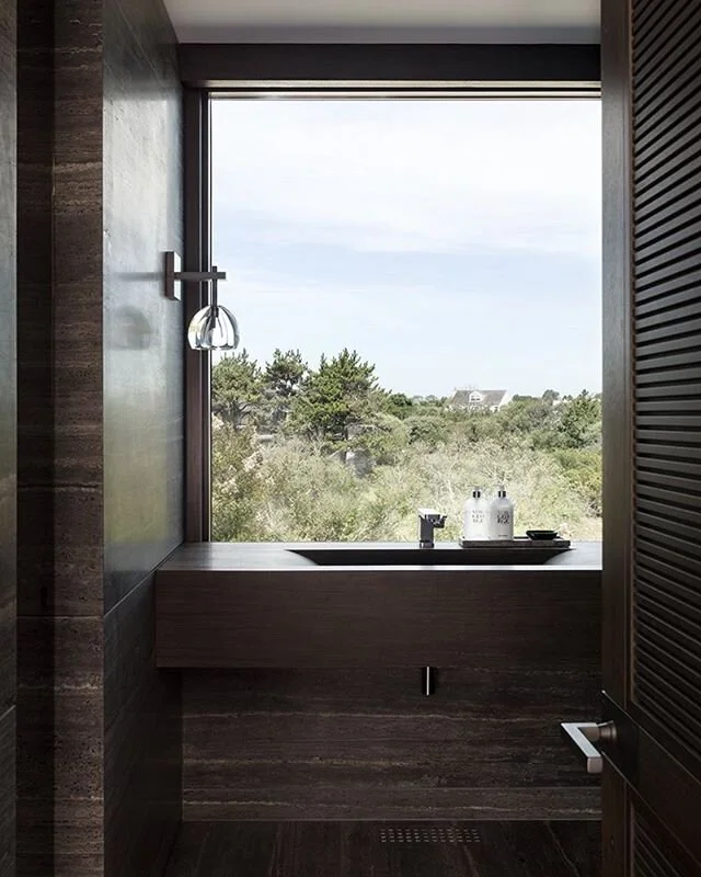 One from the archives..seaside powder room with black travertine and wenge in Sagaponack.  Photo by @paulraeside .
.
.
#hamptons #architecture #interiordesign #kosullivan #southampton  #watermill #bridgehampton #sagaponack #sagharbor #easthampton #am