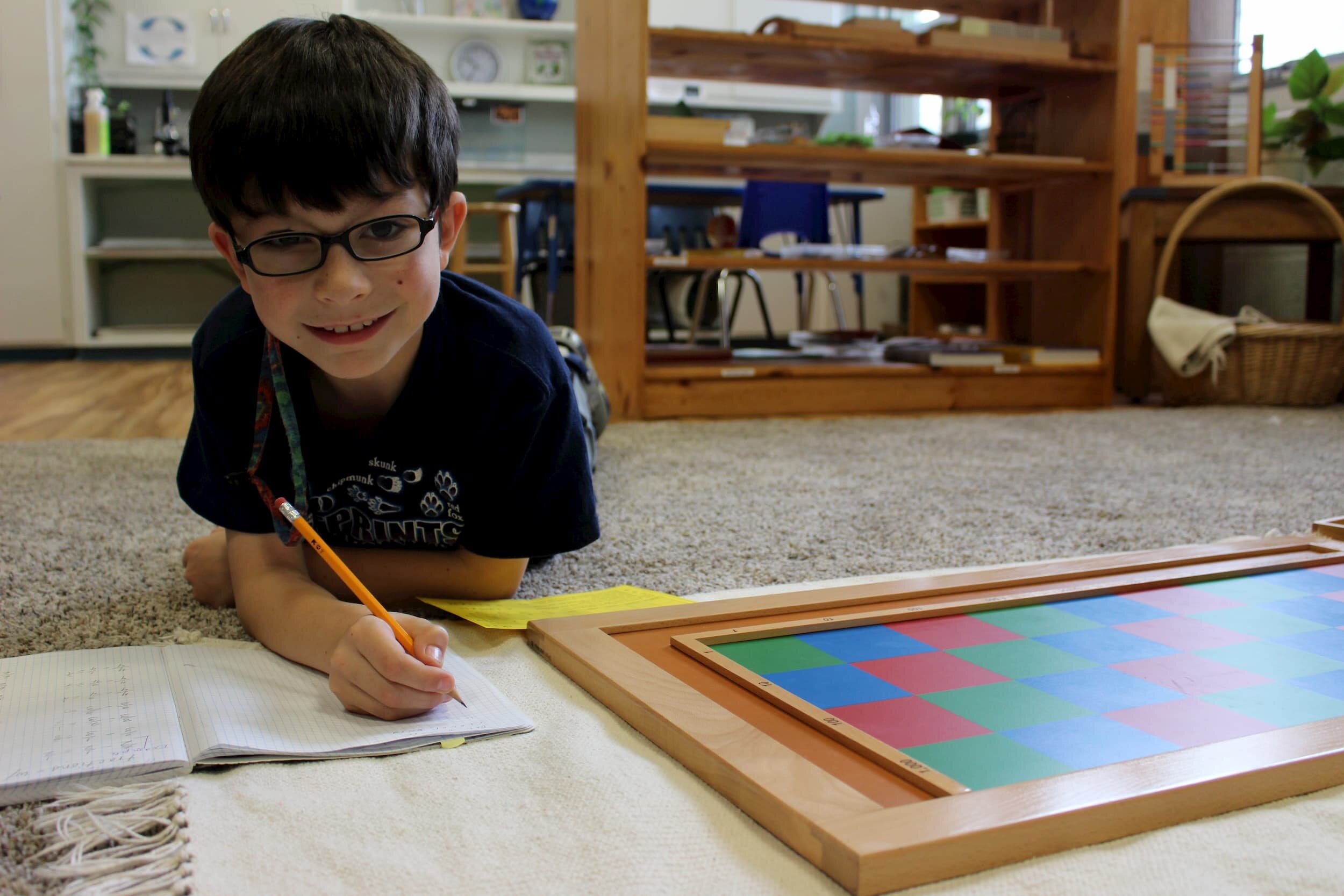 boy-on-ground-with-checkered-box.jpg