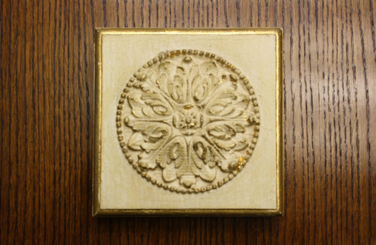GILDING - Process of applying either metal leaf or true gold leaf to surfaces.