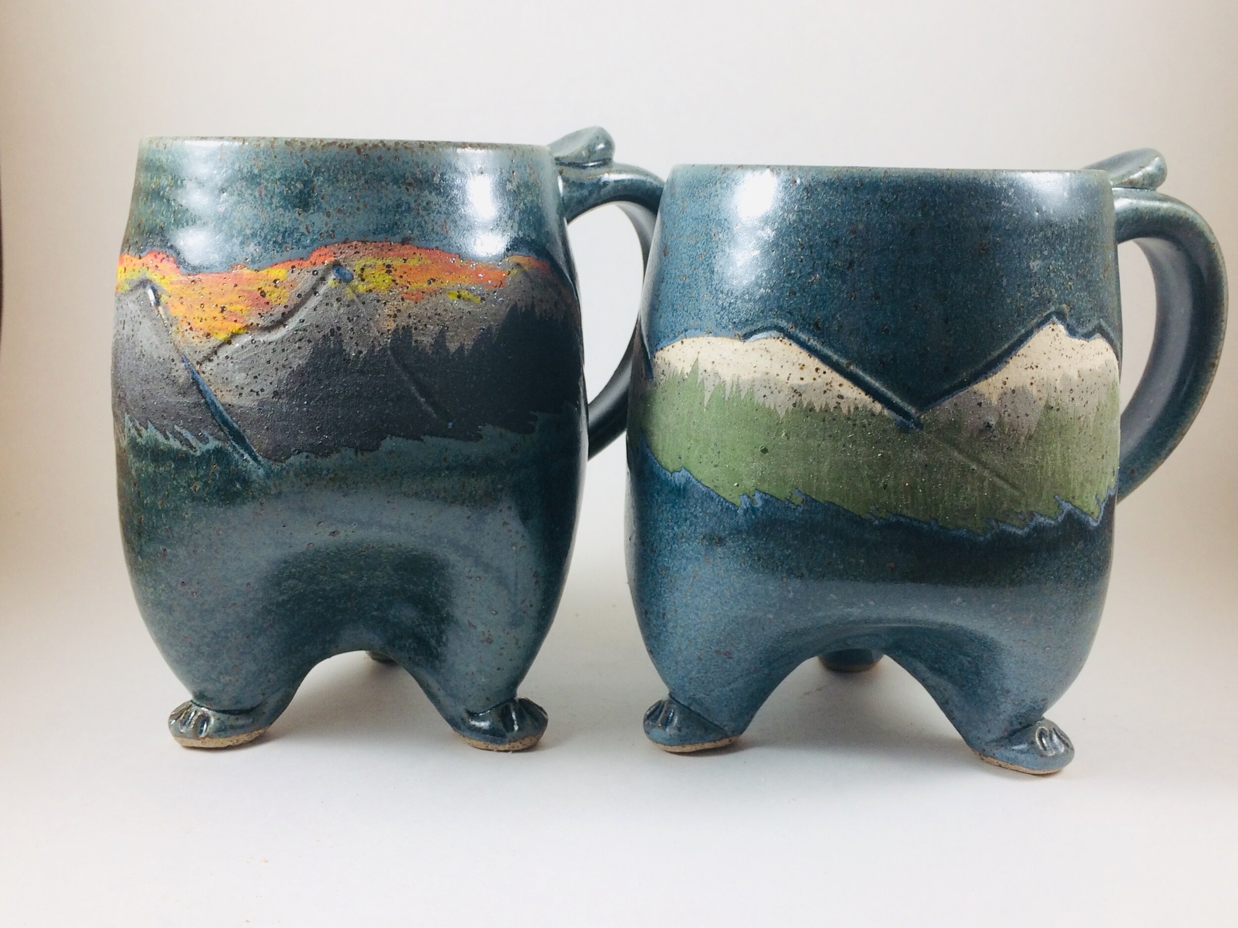 Mountain Pattern footed mugs handcrafted by Michael Gibbons of Nutfield Pottery, Derry, NH, USA