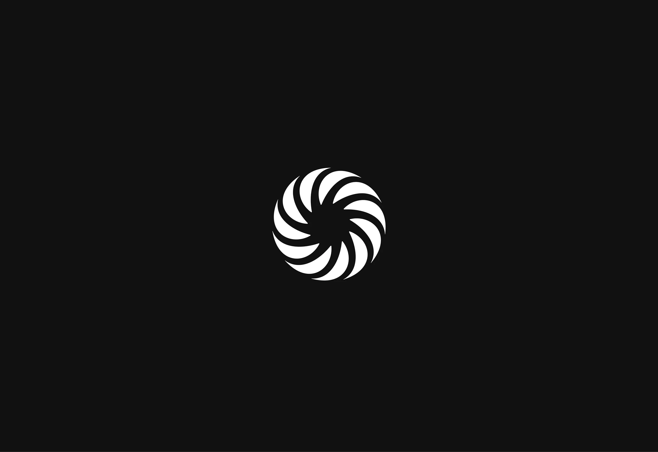 White spiral design on a black background.