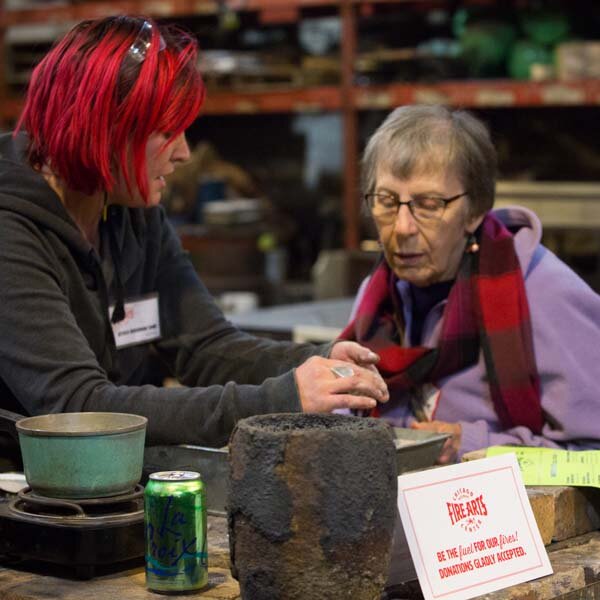  Photo of casting artist showing student how to make a mold. 