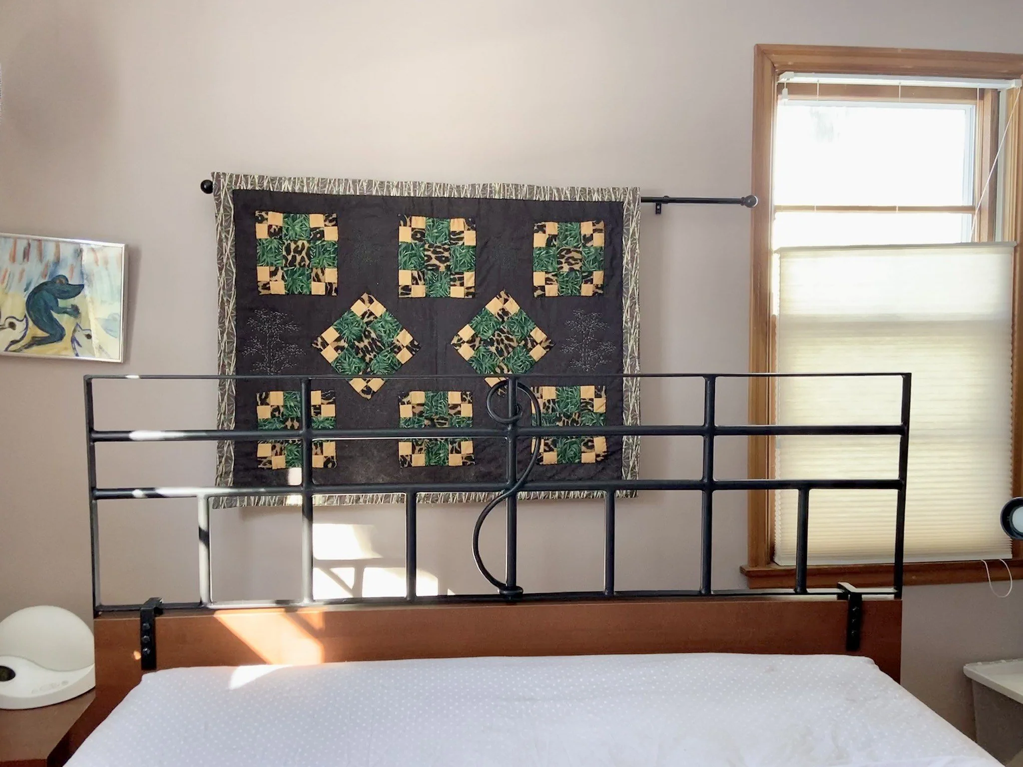 Custom headboard that doubles as a mobility aid. Made from welded steel by Becca Cerra.