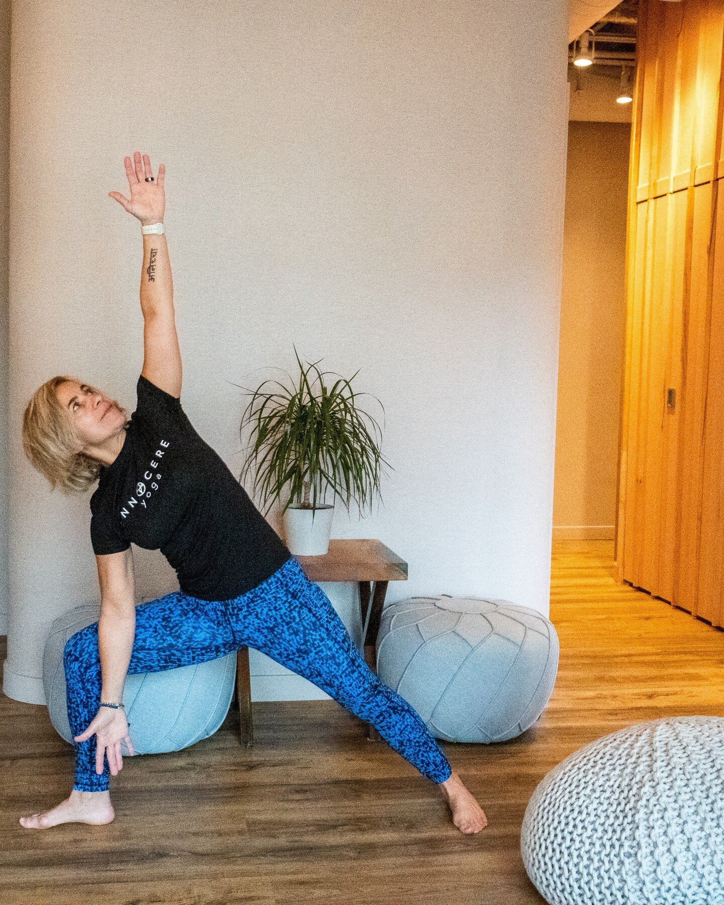 Bent Triangle Pose is a variation of triangle pose and is a foundational yoga asana practiced in most classes.  Anchoring into the posture with grounded feet and strong legs, allows the spine to twist and the heart to open.  It also:⁠
- Strengthens t