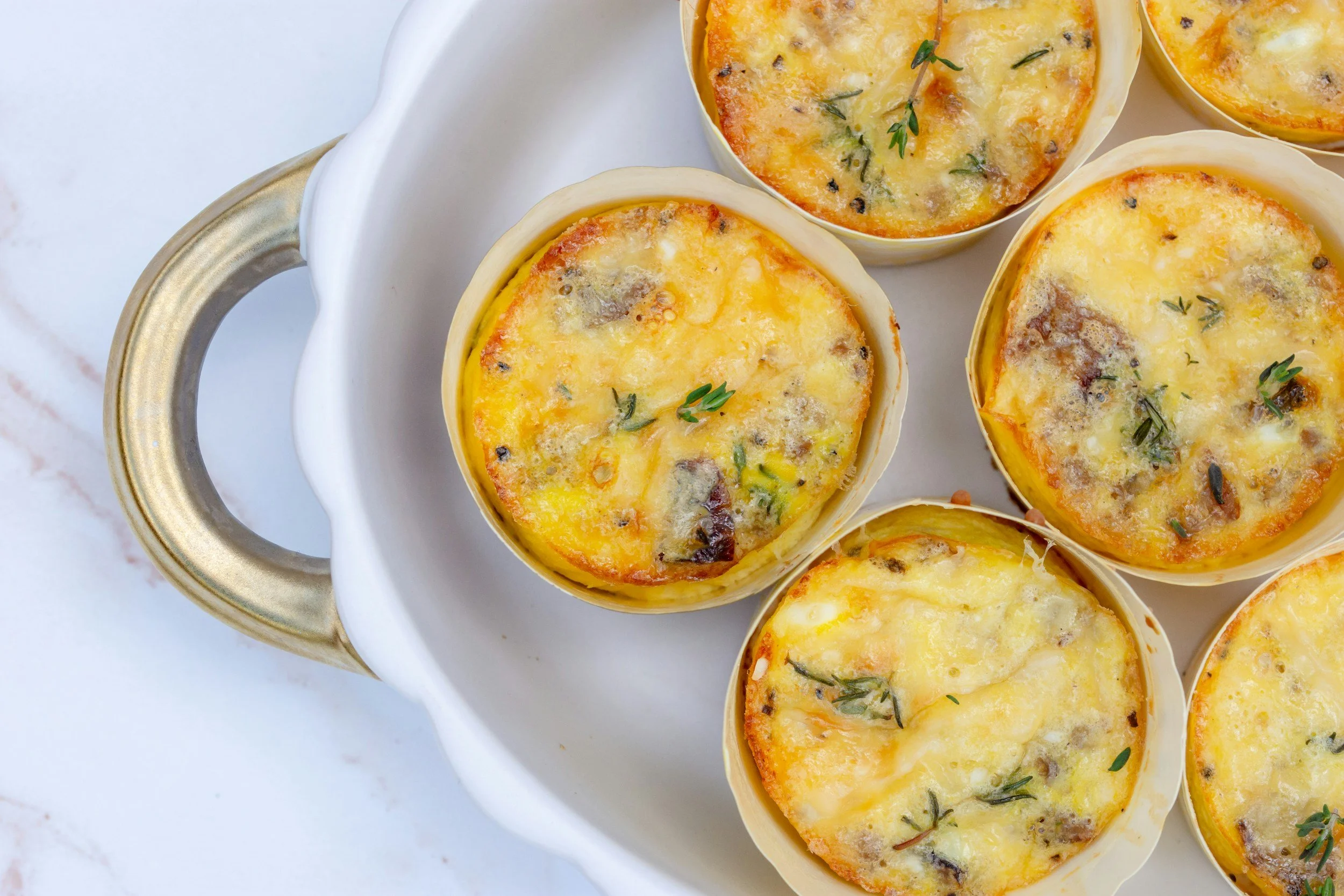 egg bites arranged on a ceramic serving dish